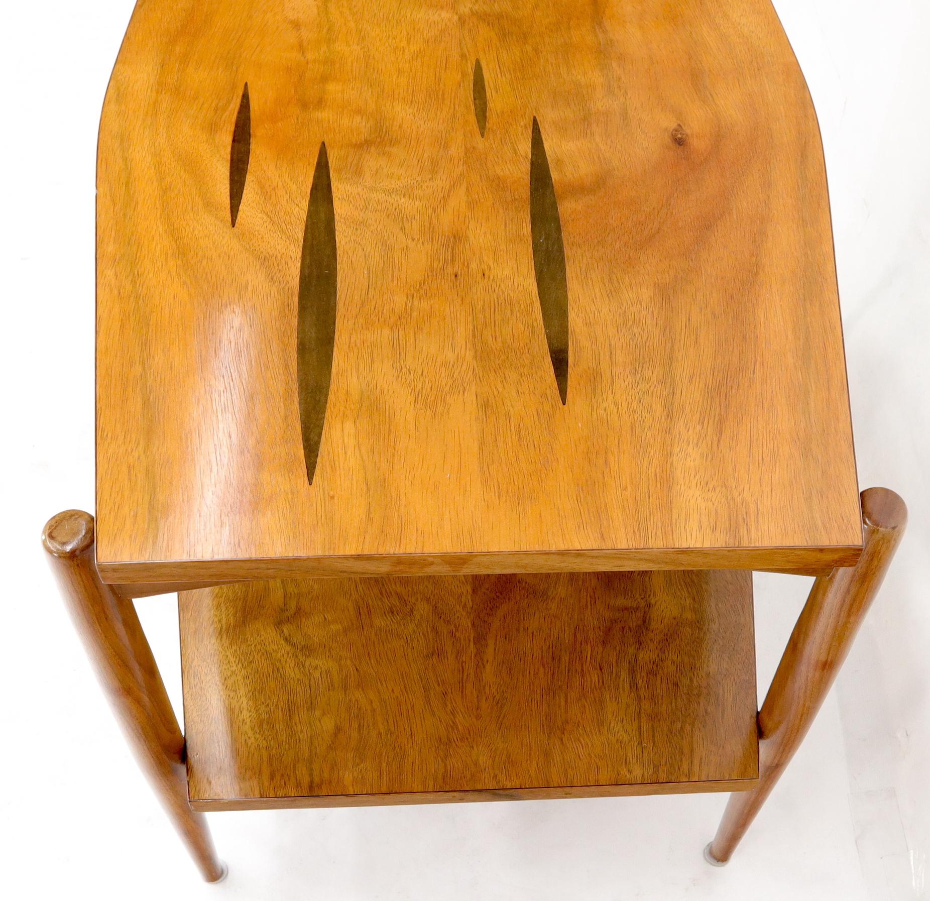 Pair of Mid-Century Modern inlaid tops boat shape one shelf exposed sculptured legs end side tables.