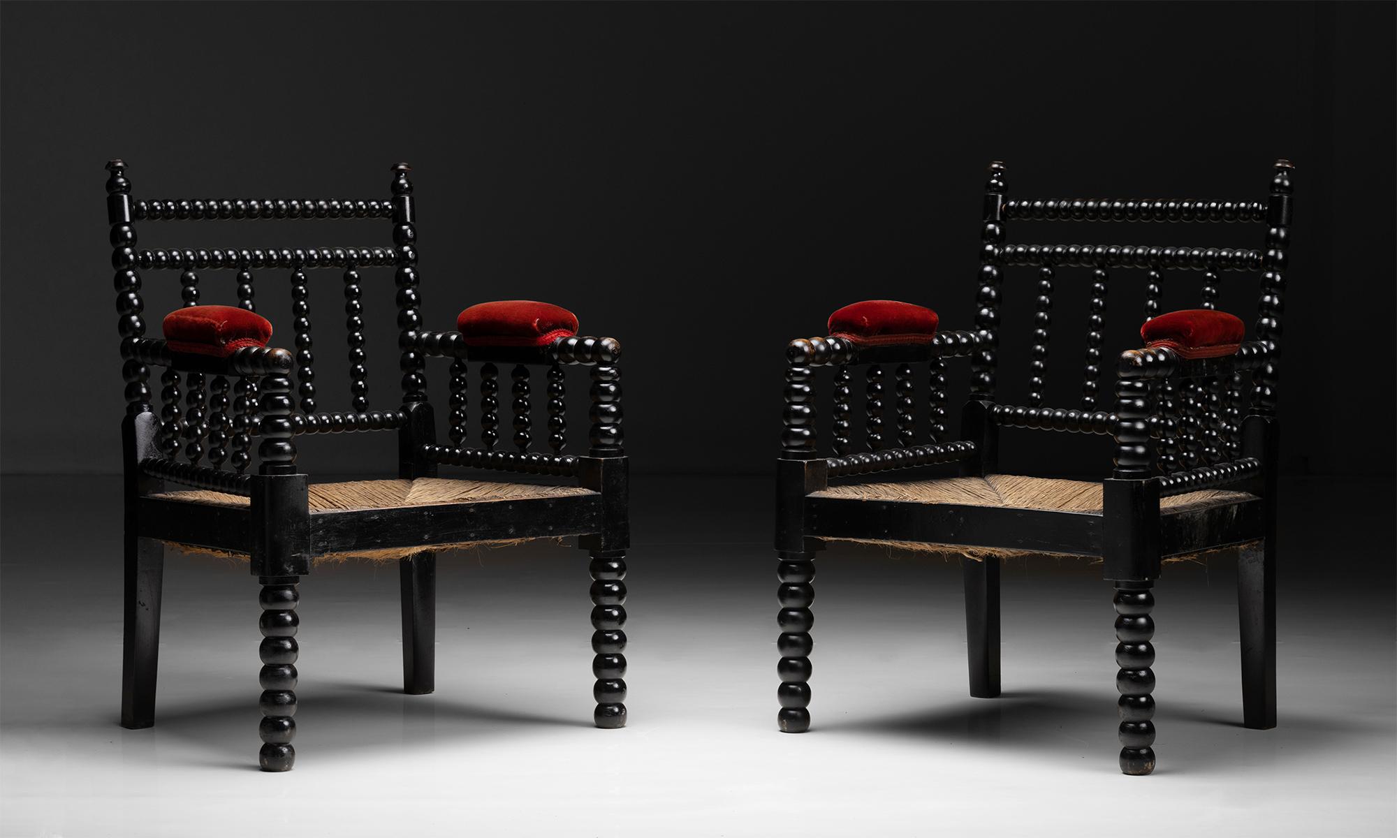 Bobbin Armchairs

England circa 1880

Ebonised frame with red velvet armrests and original rush seats.

25”w x 20”d x 33.75”h x 14”seat.