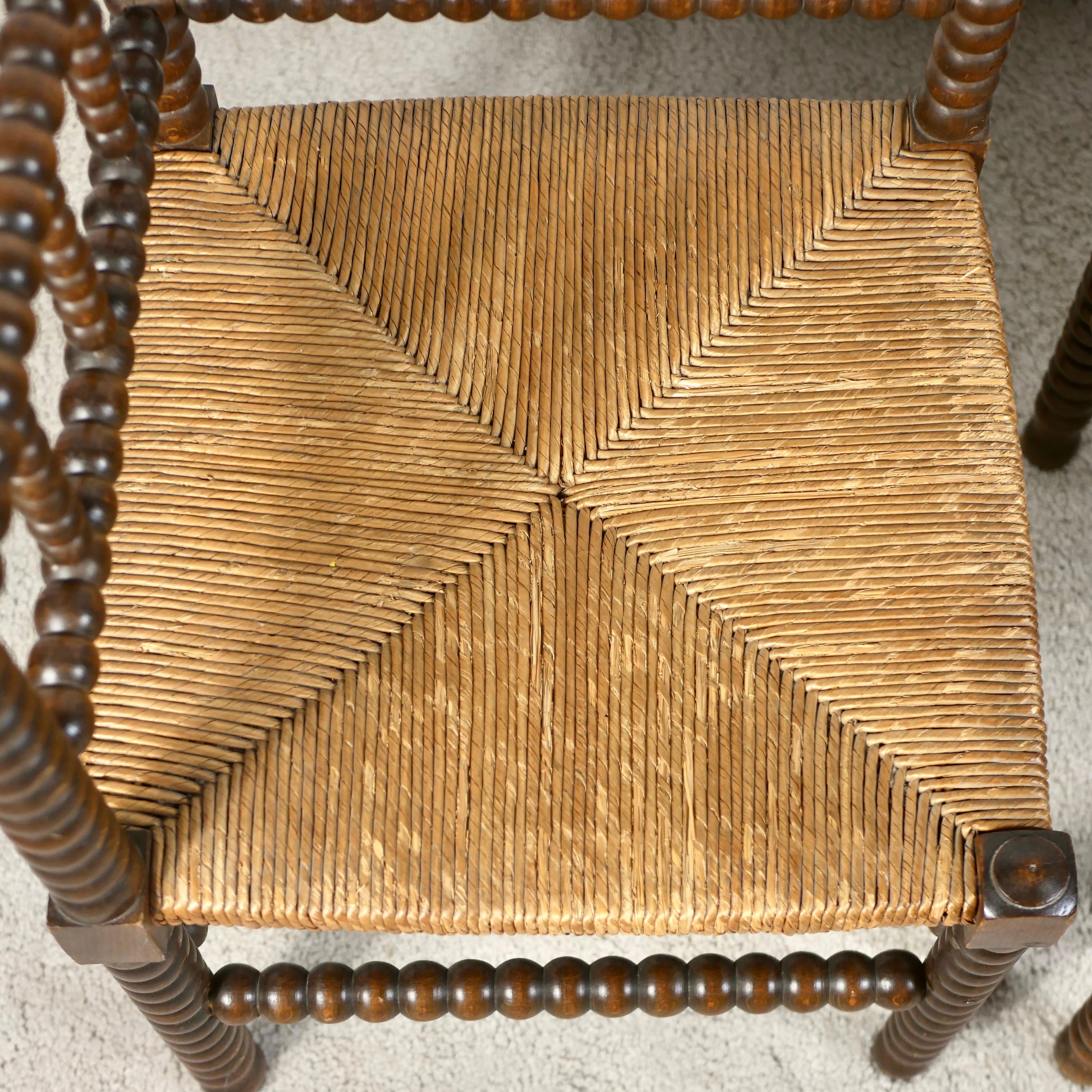 Straw Pair of Bobbin corner chairs, wood and straw, France, early 20th century