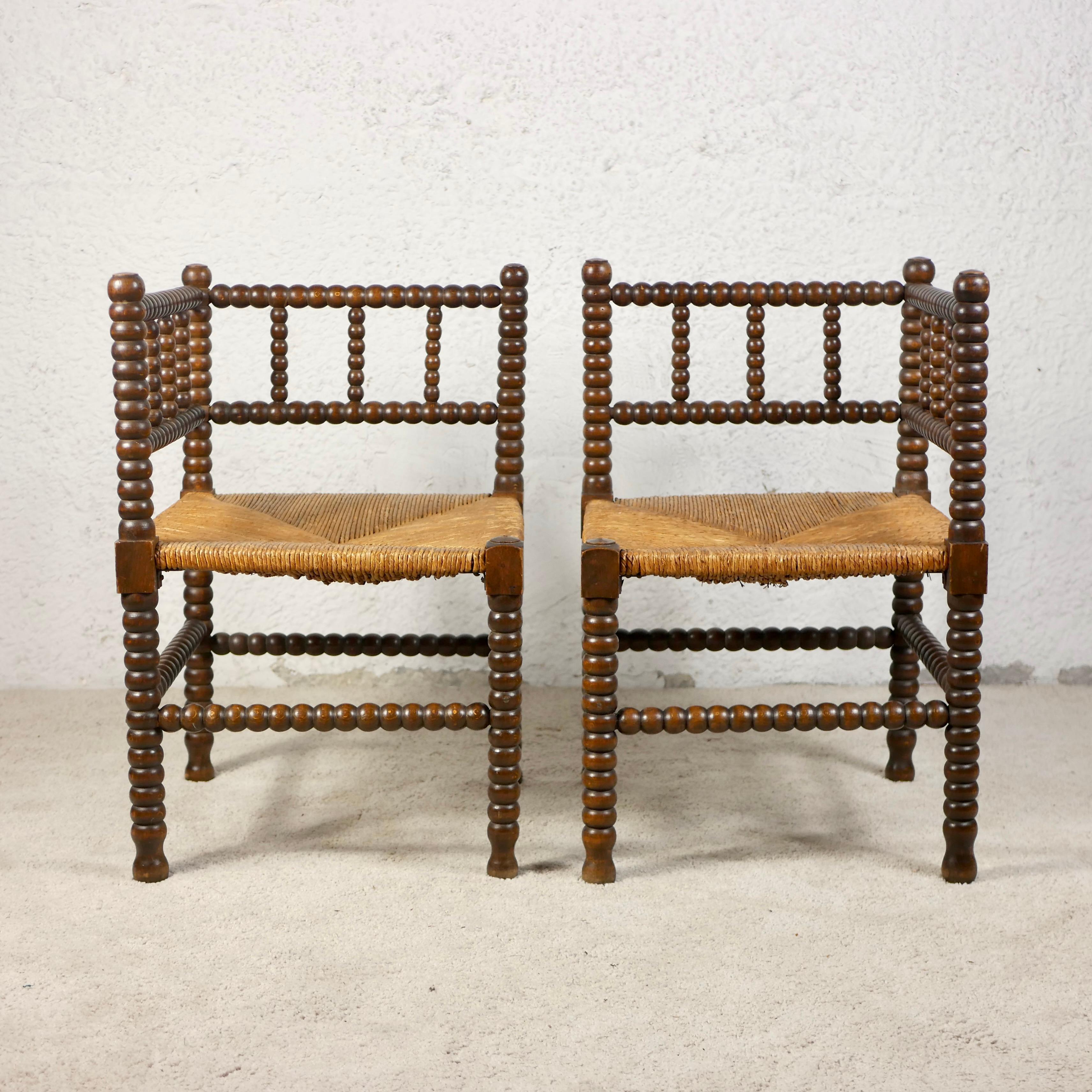 Nice pair of two corner chairs, also called Bobbin chairs, made in France between the second half of the 19th century and the beginning of the 20th century. 
They were common pieces of furniture especially in the countryside and were used as