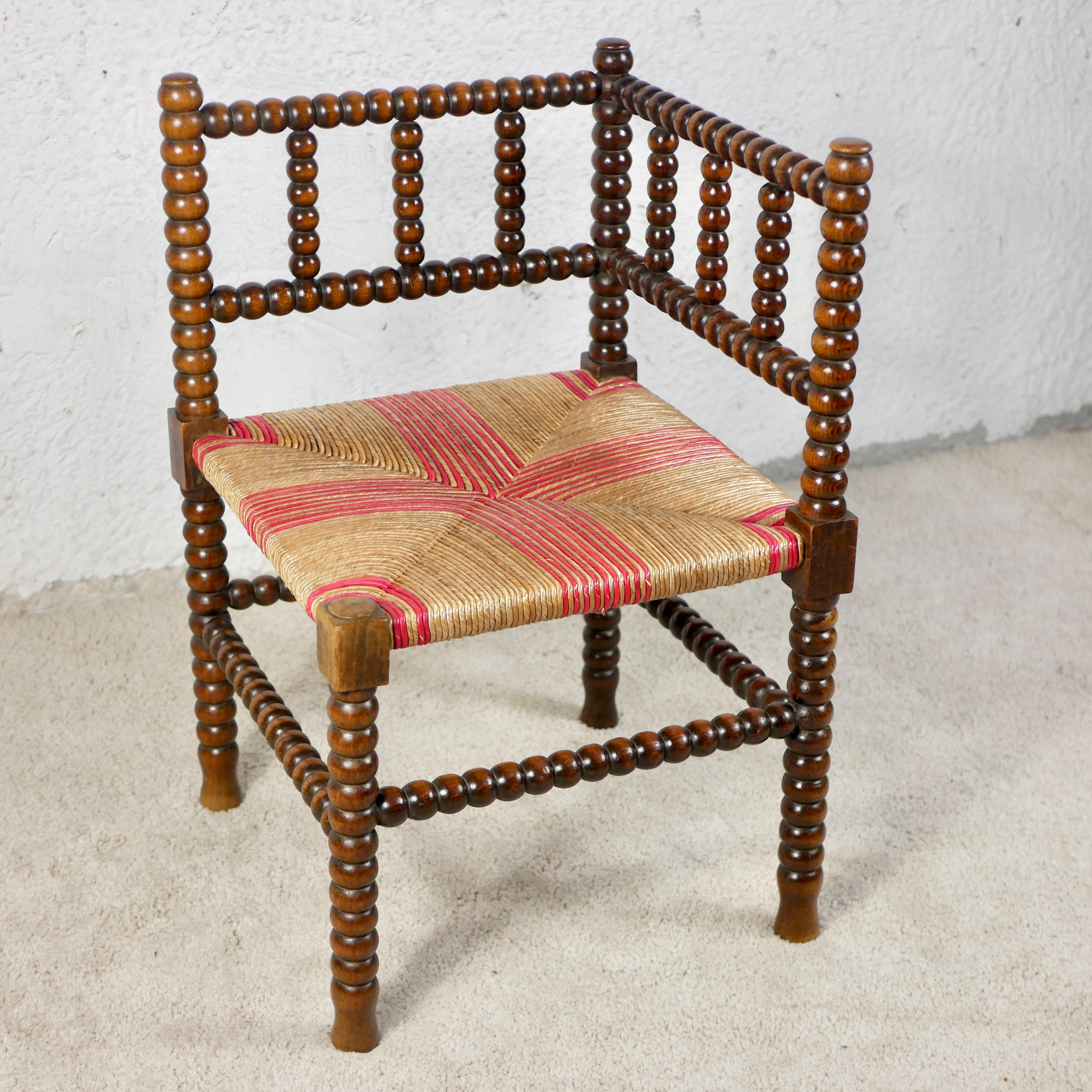 French Pair of Bobbin corner chairs, wood and straw, France, early 20th century For Sale