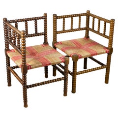 Pair of Bobbin corner chairs, wood and straw, France, early 20th century