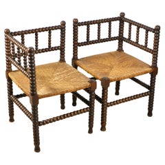 Pair of Bobbin corner chairs, wood and straw, France, early 20th century