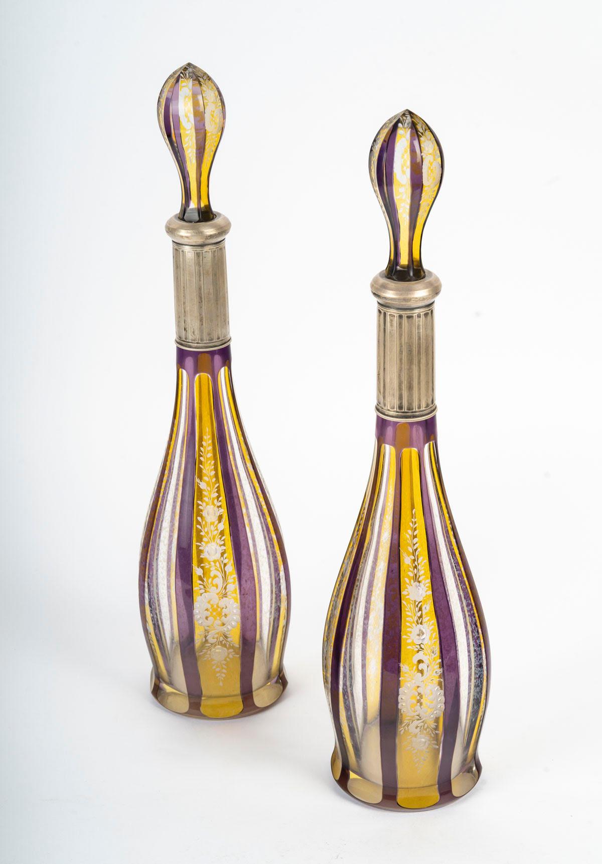 Pair of Bohemian crystal decanters, early 20th century, Napoleon III style.

Pair of Bohemian crystal decanters, silver-plated metal mounts, Napoleon III style, early 20th century.
H: 45cm, D: 12cm