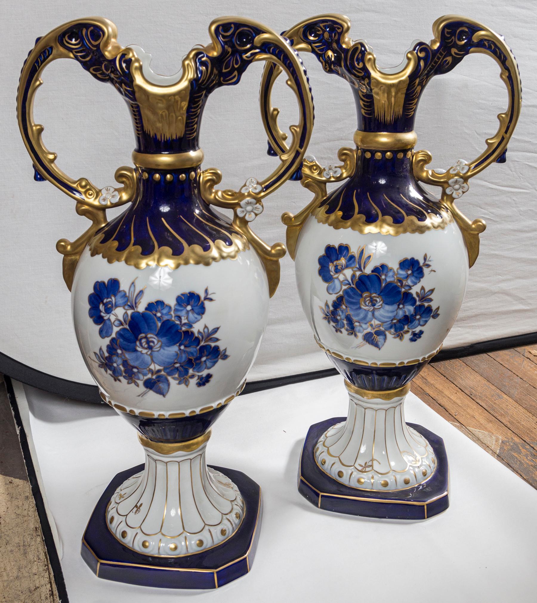 This pair of vases, are identical to previously listed pair of ewers, except for the addition of 2 handles on either side and the loss of the ewer spouts.