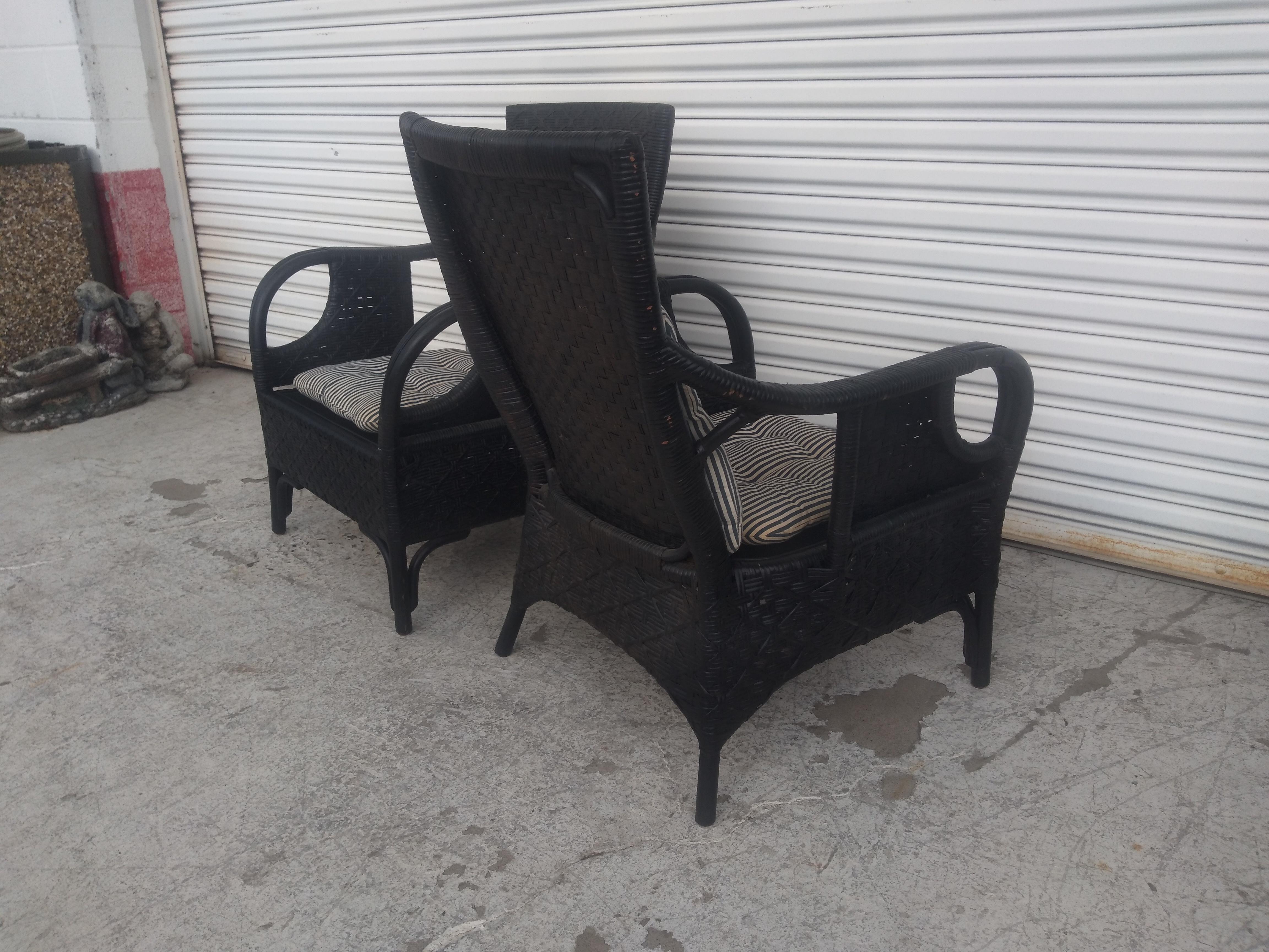 This is a stunning pair of Boho chic lounge chairs from the Philippines. The chairs are made of bent bamboo and rattan. The chairs are hand woven and have optional cushions.