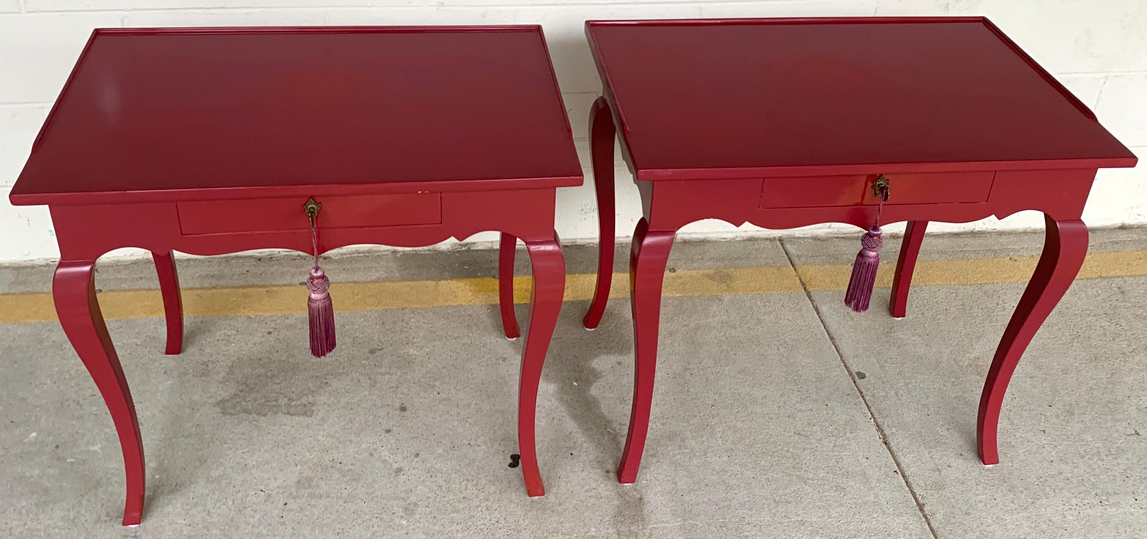 Pair of bold mauve lacquered end/ nightstands tables, each one neoclassical in style with slight gallery edge top, fitted with one key locking 15