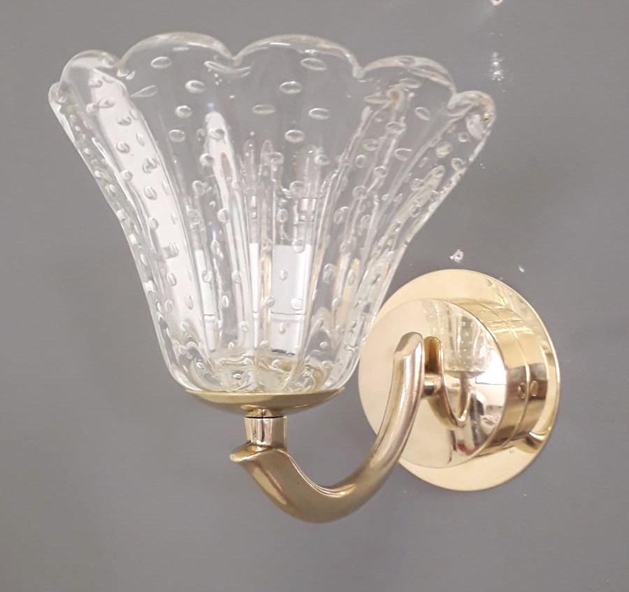 Vintage Italian wall lights with hand blown Murano glass cups hand blown with bubbles inside the glass using Bollicine technique, mounted on brass frames / Made in Italy by Barovier e Toso, circa 1950s
Original mark on the backplate
Measures: Height