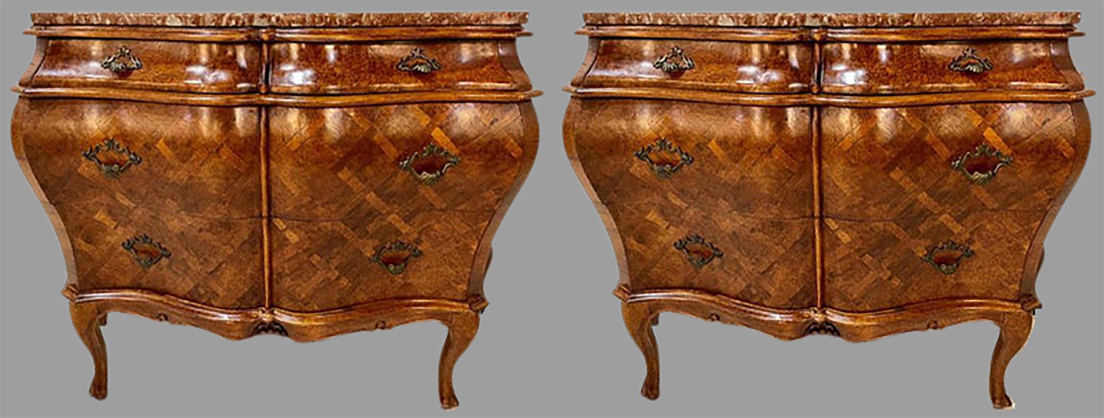 A pair of olive wood Bombay Italian commodes circa 1950, each having three drawers on a parquetry inlaid case. The pair with fine parquetry inlaid tops that have later custom marbles which can also be used. Graduating drawers.
PhX.