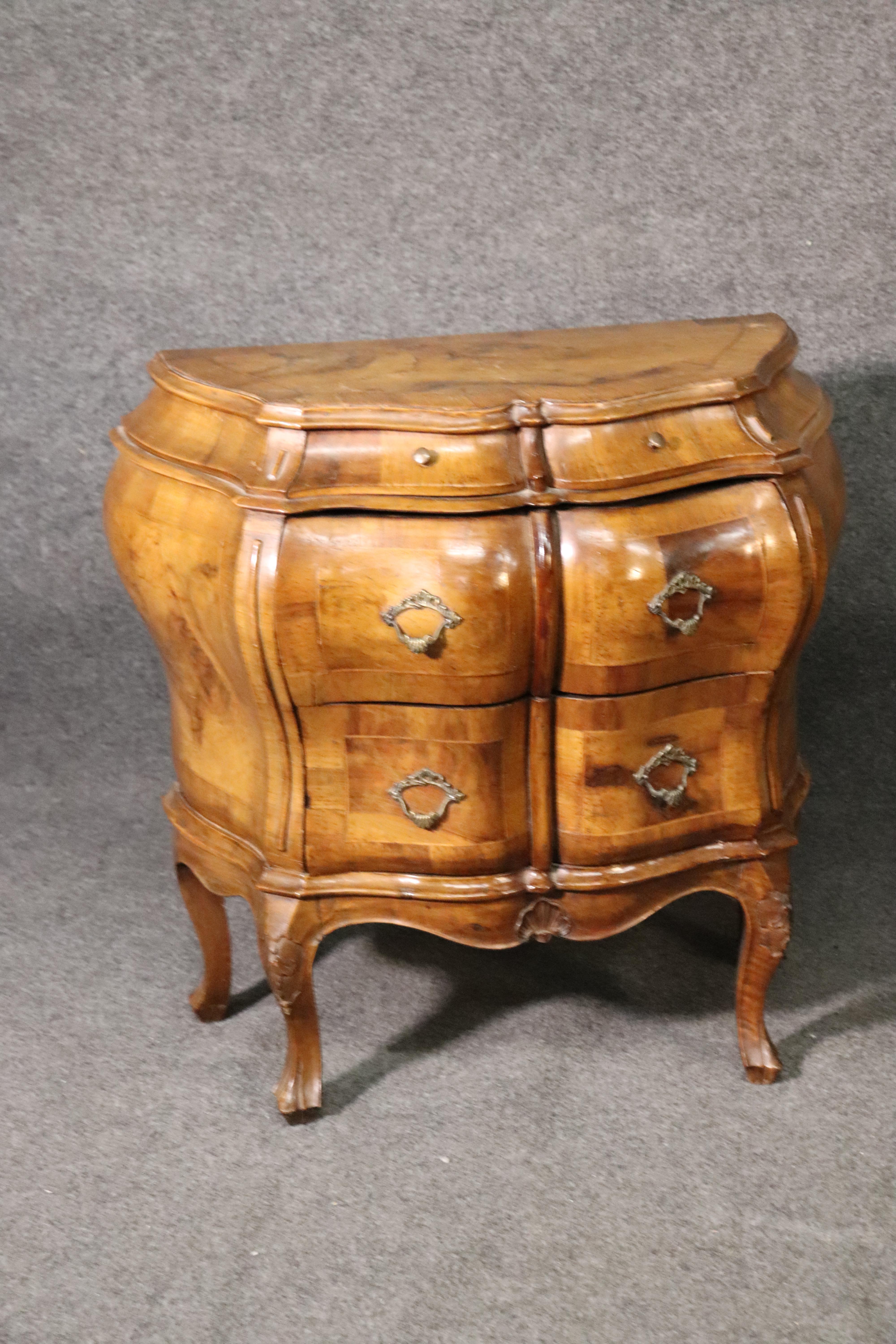 This is a beautiful pair of burled olivewood rococo style Italian commodes. The stands are beautiful and measure 27 tall x 29 wide x 14 deep. The stands can be used in many ways and not just as nightstands.