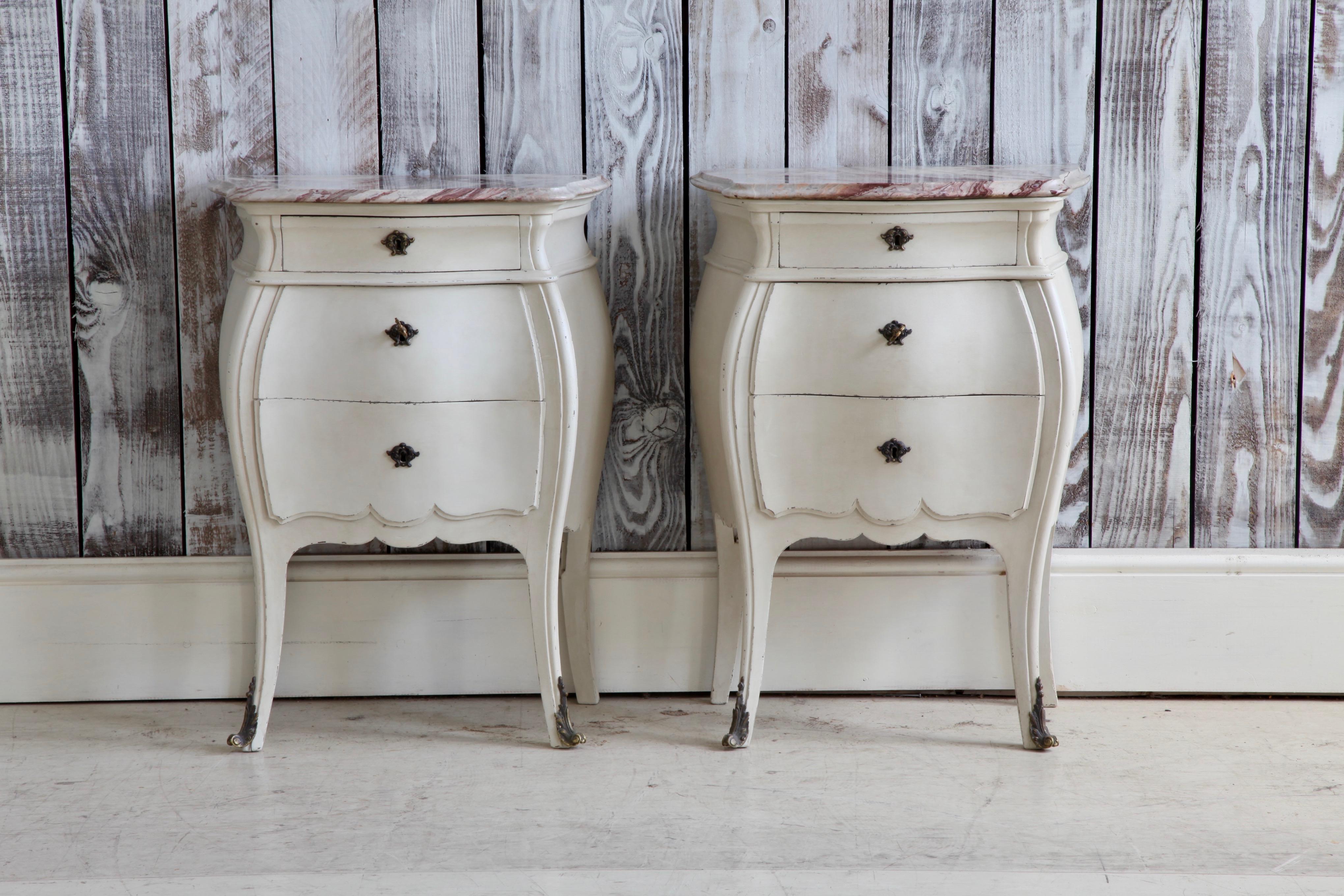 Pair of Louis XV style painted bedside tables with marble top.
Painted in a French grey color with a breche type marble.