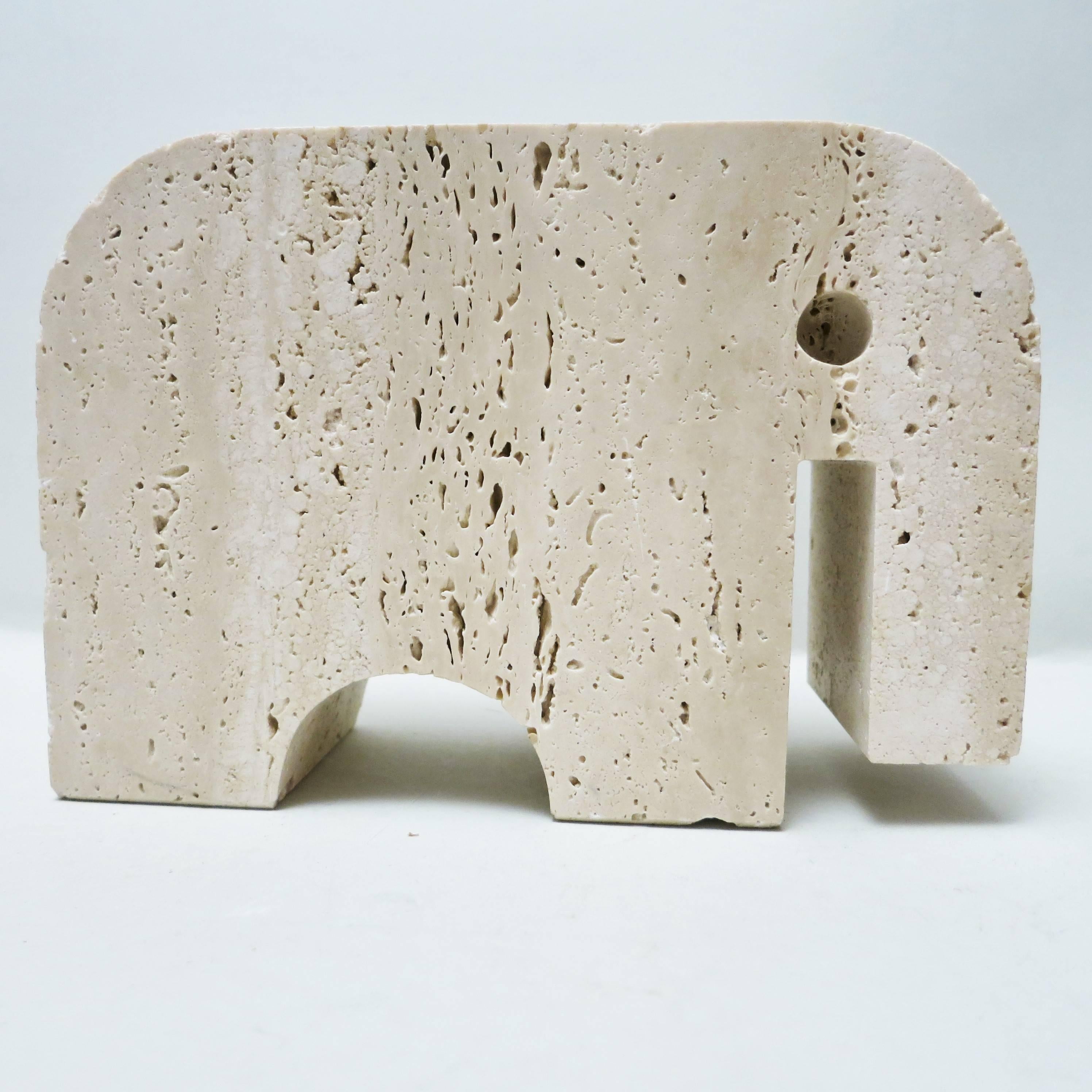 Pair of bookends elephant carved in a block of travertine from Rapolano designed and produced by Fratelli Mannelli in Signa, Italy, circa 1970.
  