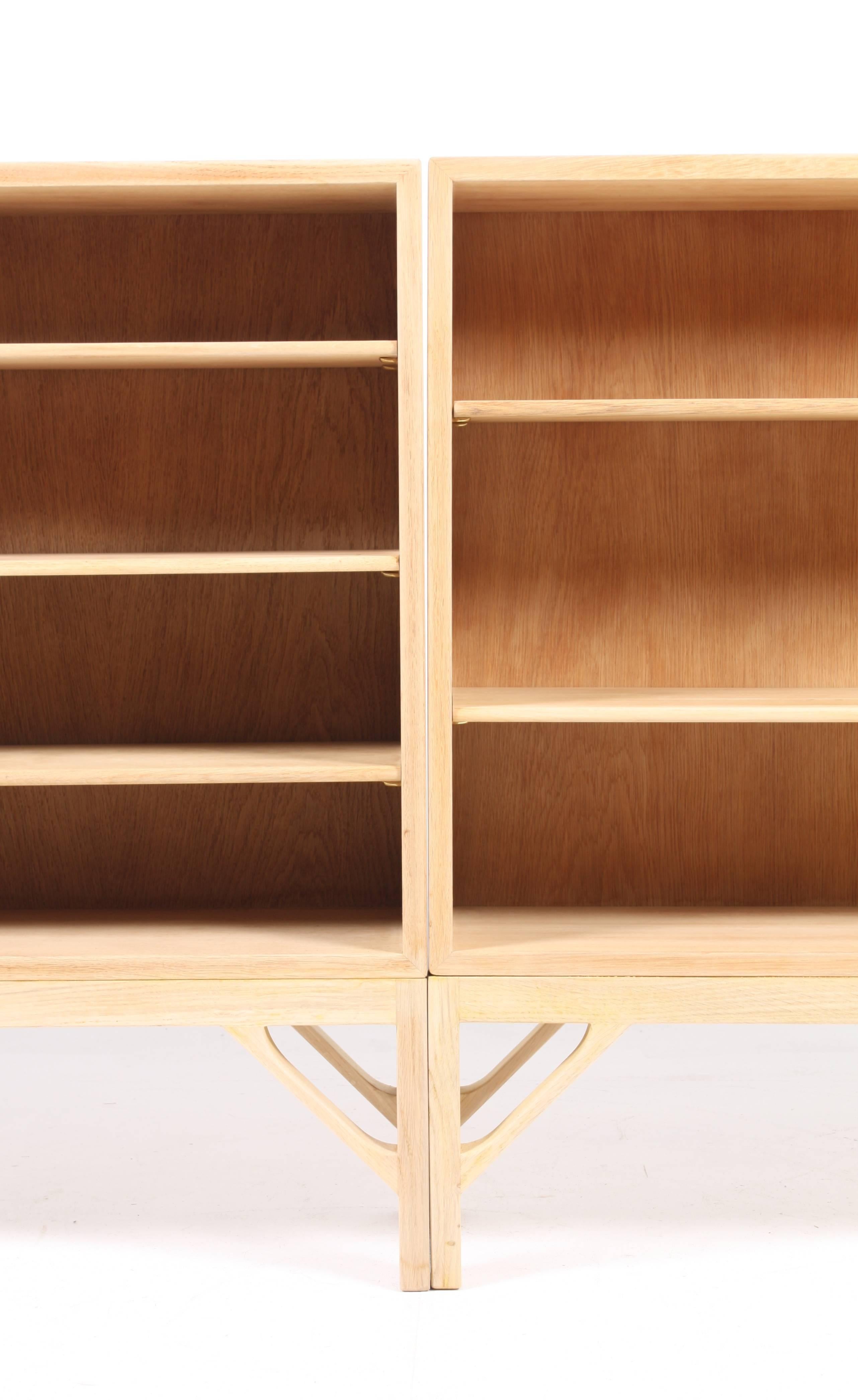 Pair of pristine bookcases with adjustable shelves in white soap finished Scandinavian oak designed by Maa. Børge Mogensen for C.M. Madsen cabinetmakers in 1958. Made in Denmark in the 1960s. Great condition.