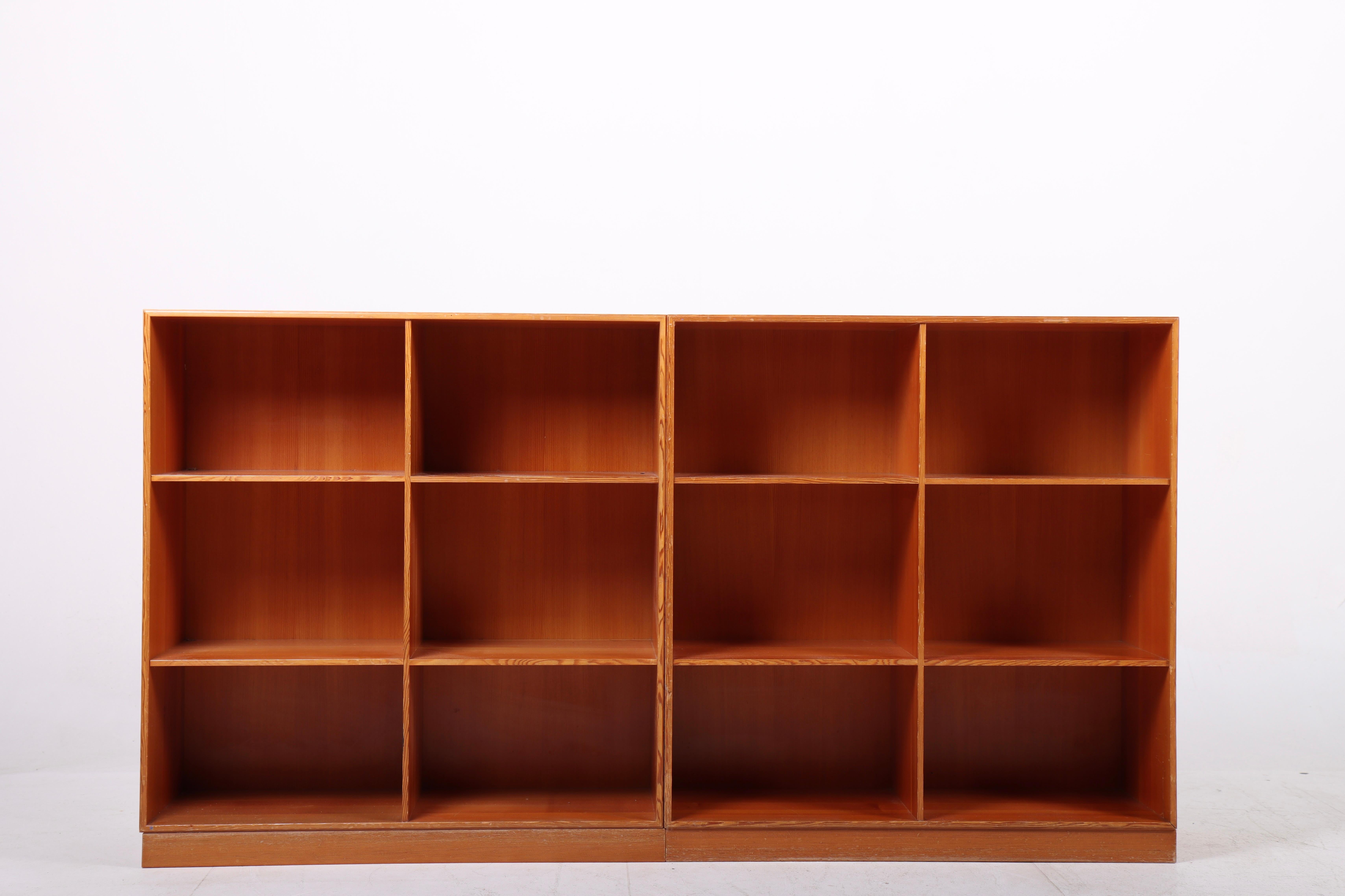 Pair of bookcase in solid Oregon pine. Designed by Mogens Koch for Rud. Rasmussen cabinetmakers in 1933. Made in Denmark. Great original condition.