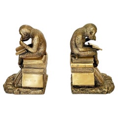 Pair of bookends depicting sculptures of monkeys in gilded metal, France, 1970