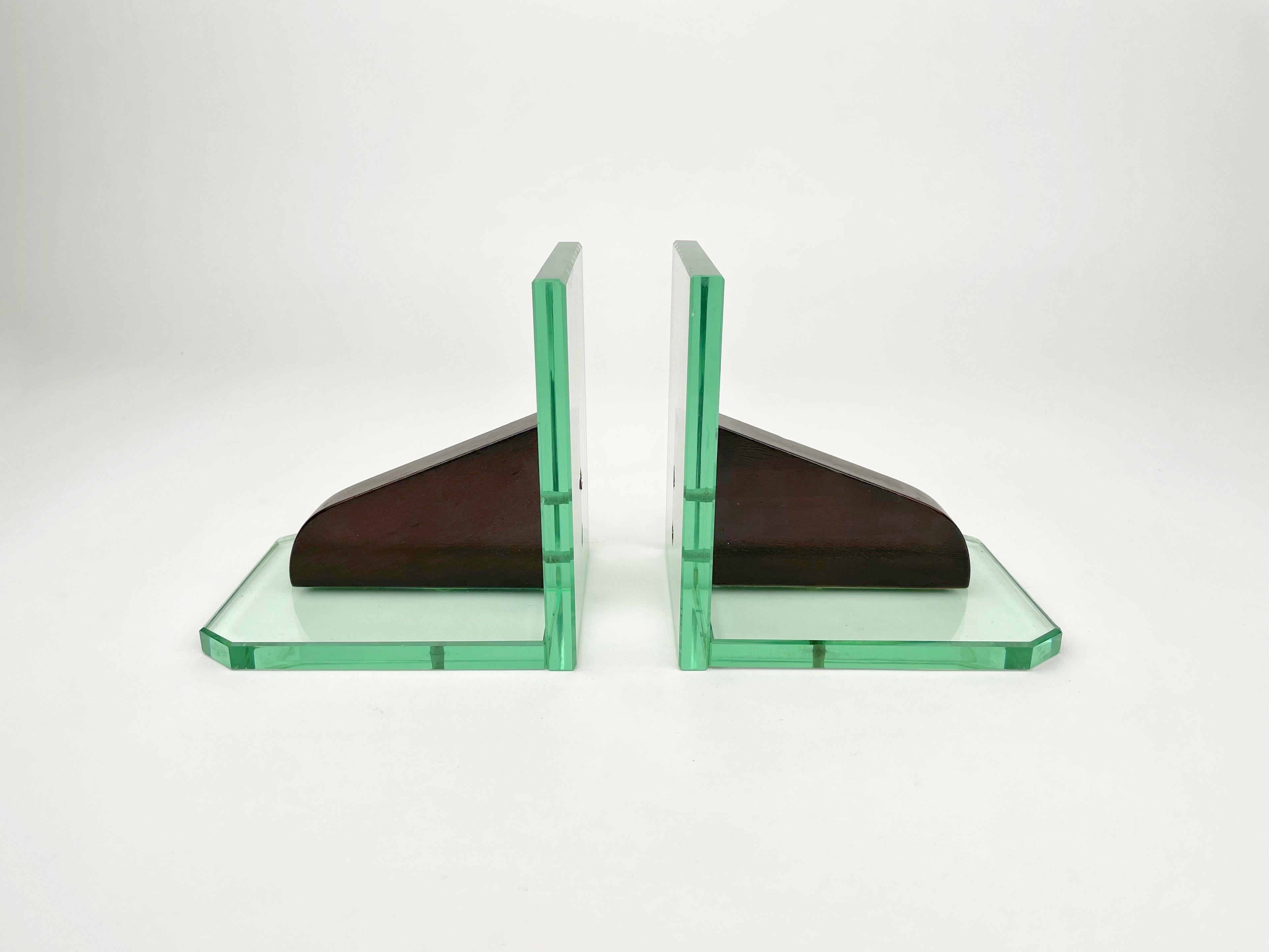 Pair of bookends in acquamarine glass structure and wood in the style of Fontana Arte. Made in Italy in the 1950s.
