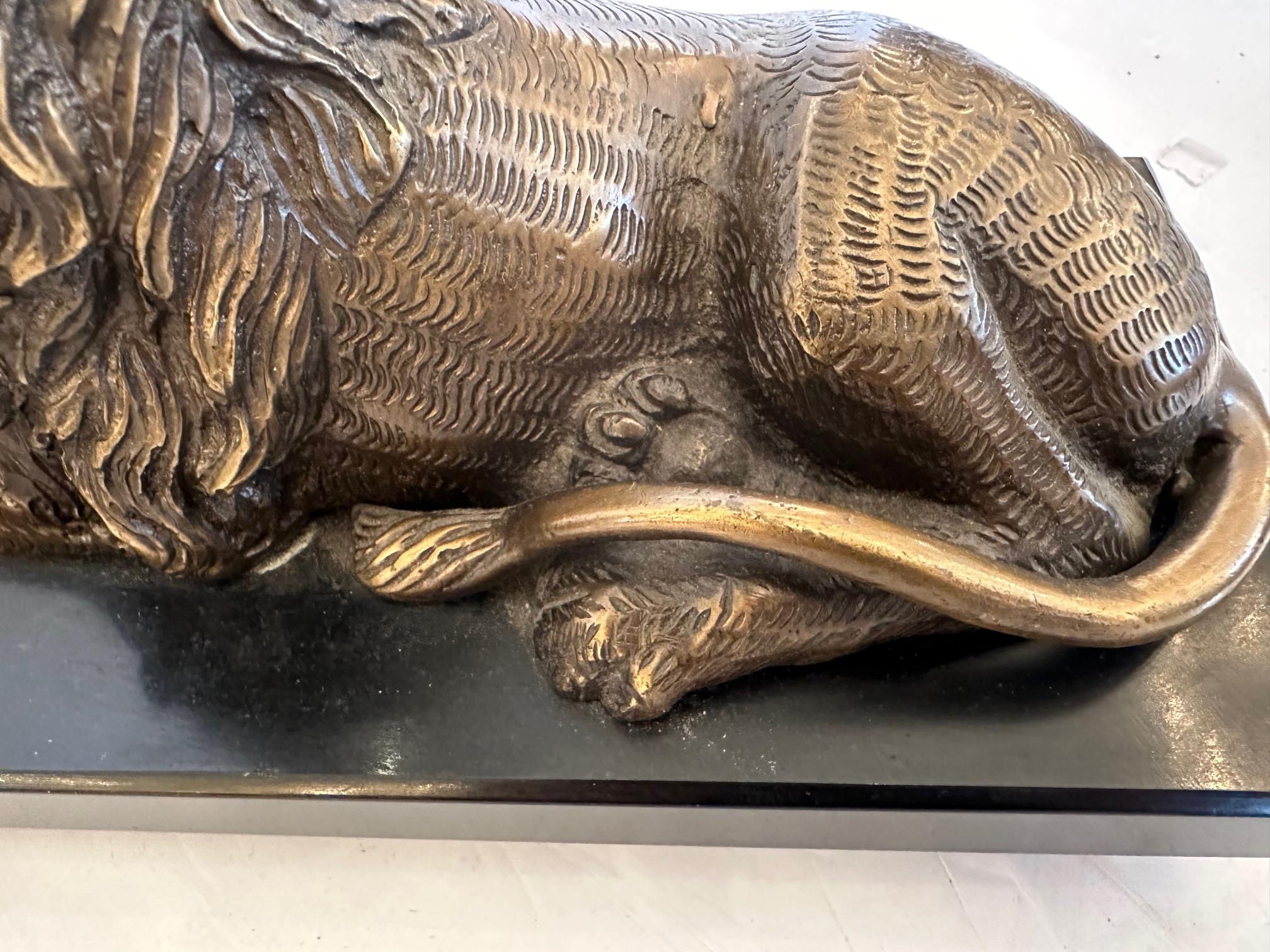 French Pair of Bookends Having Recumbent Bronze Lions on Belgian Slate Bases For Sale