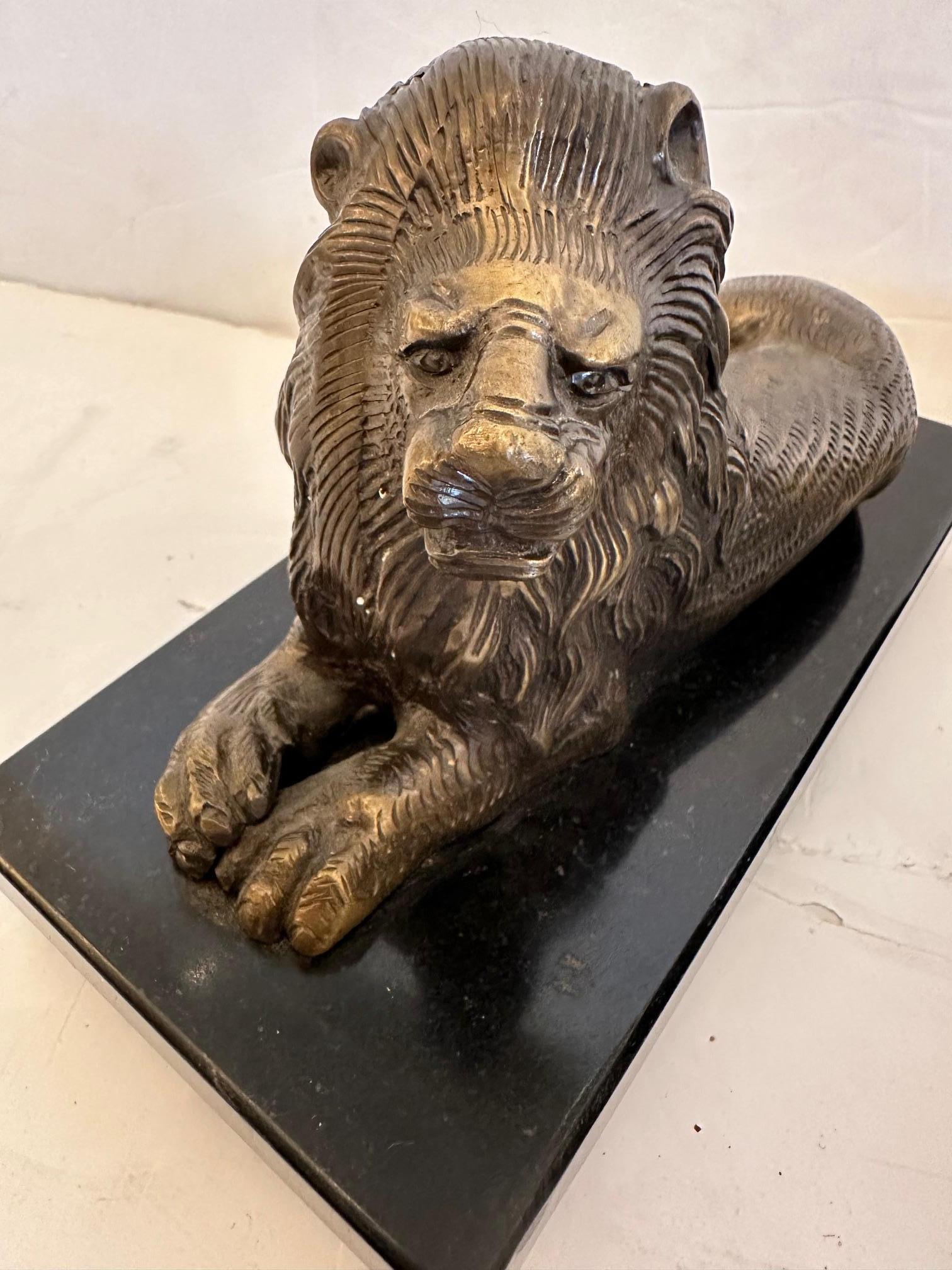 Pair of Bookends Having Recumbent Bronze Lions on Belgian Slate Bases In Good Condition For Sale In Hopewell, NJ