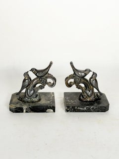 Pair of bookends with brass birds and marble bases, 19th century