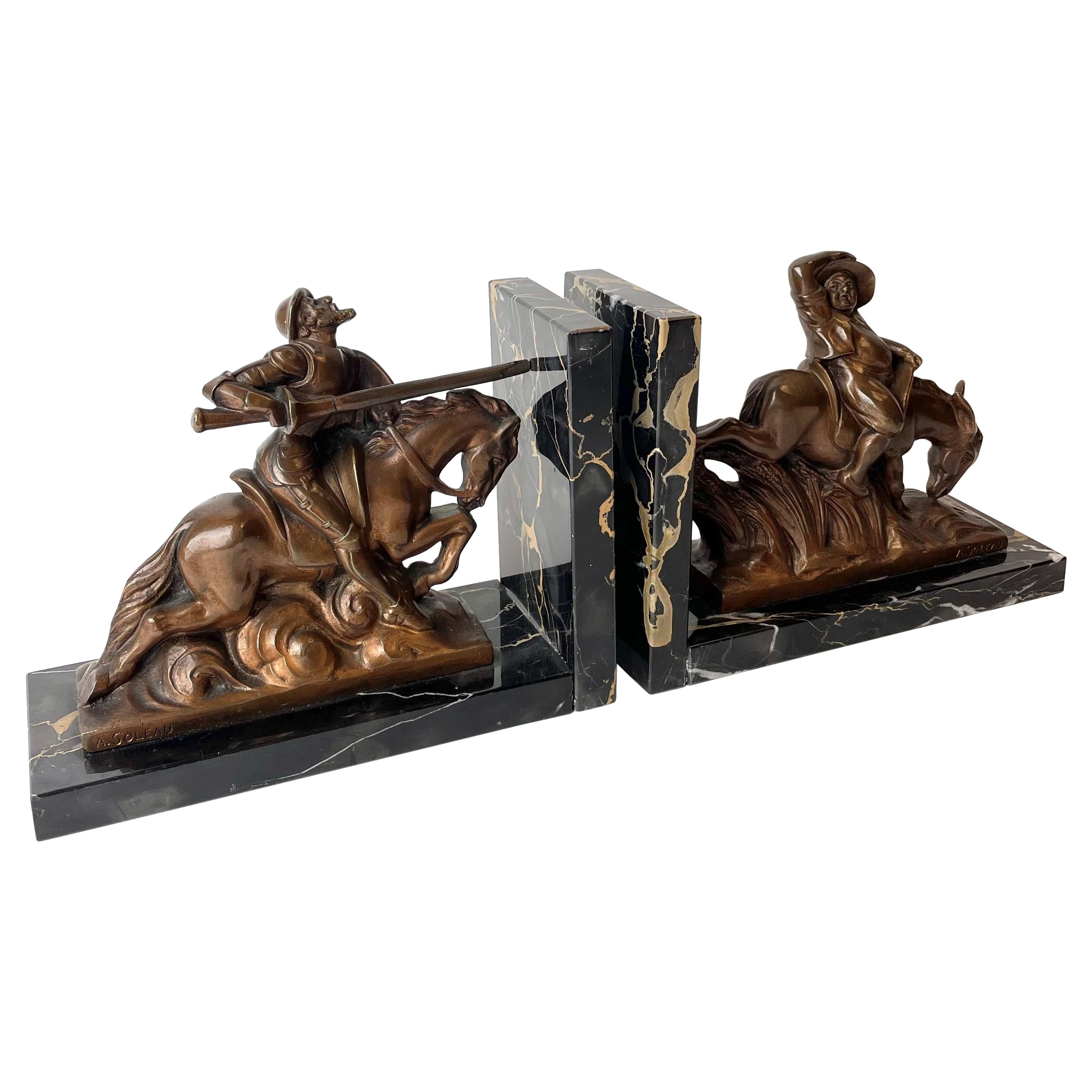 Pair of Bookends with Scenes from Don Quixote, Signed A. Soleau.