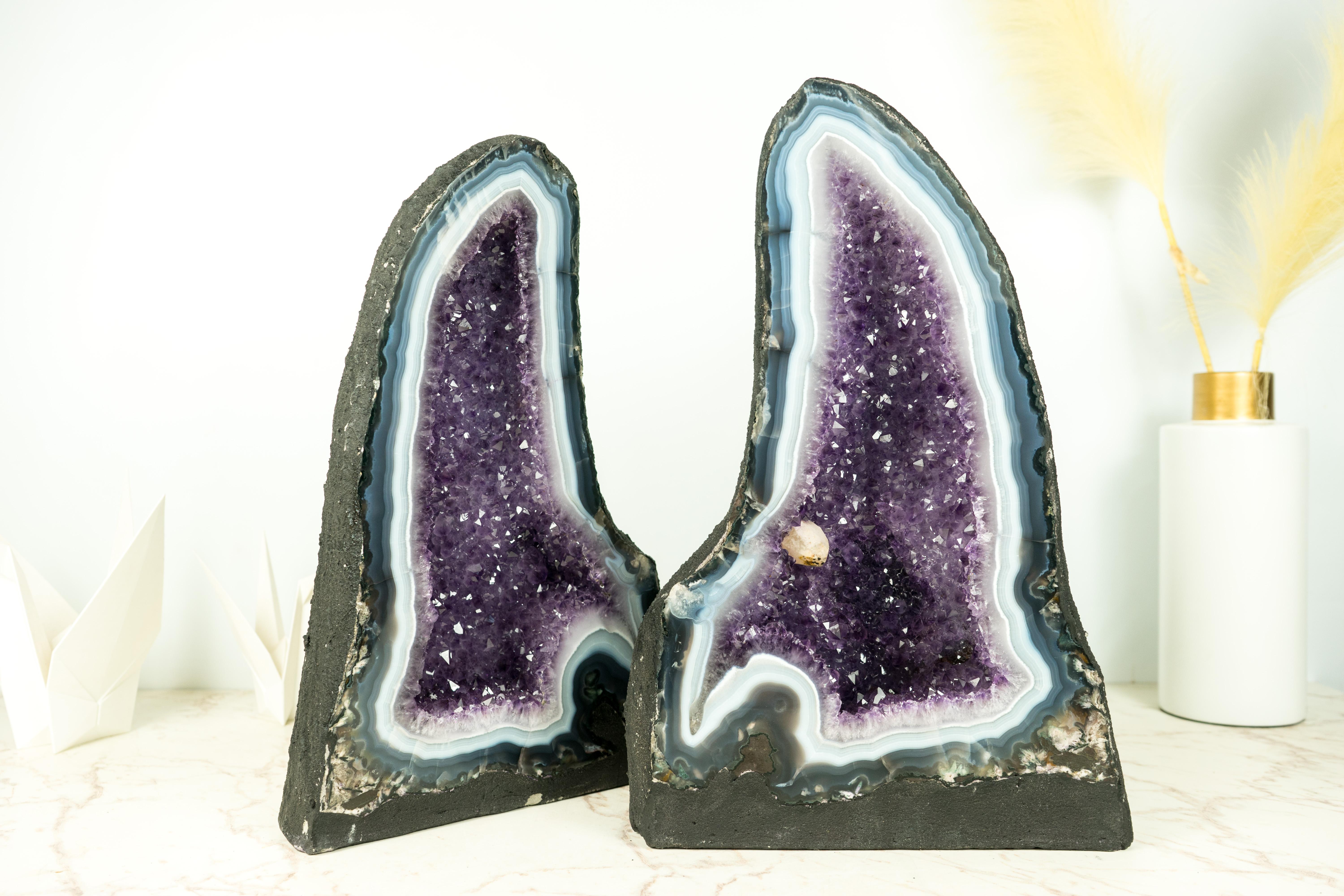 Rare Geode Pair: Bold, Intense Blue and White Banded Agate Geodes with Gorgeous Lavender Purple Amethyst and Calcite Inclusion

▫️ Description

With bold, curvy, and elegantly formed agate laces, this pair of agate geodes is a stunning specimen