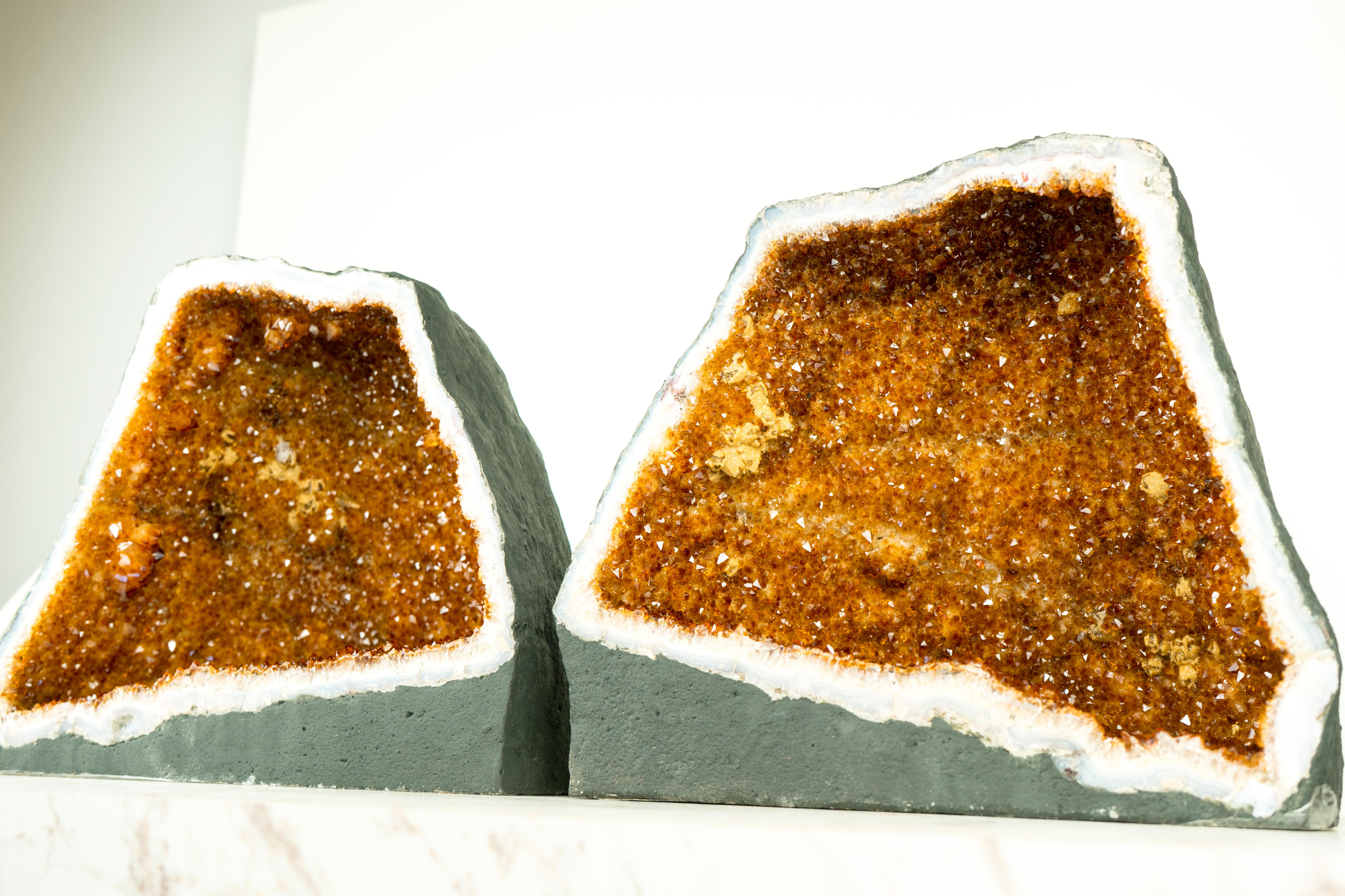 Pair of Bookmatching Citrine Geodes: A Stunning Display of Deep Orange, Sparkly Citrine Druzy

▫️ Description

This extraordinary pair of natural Citrine geodes features shiny, rich, saturated orange Citrine Druzy and beautiful small stalactites.