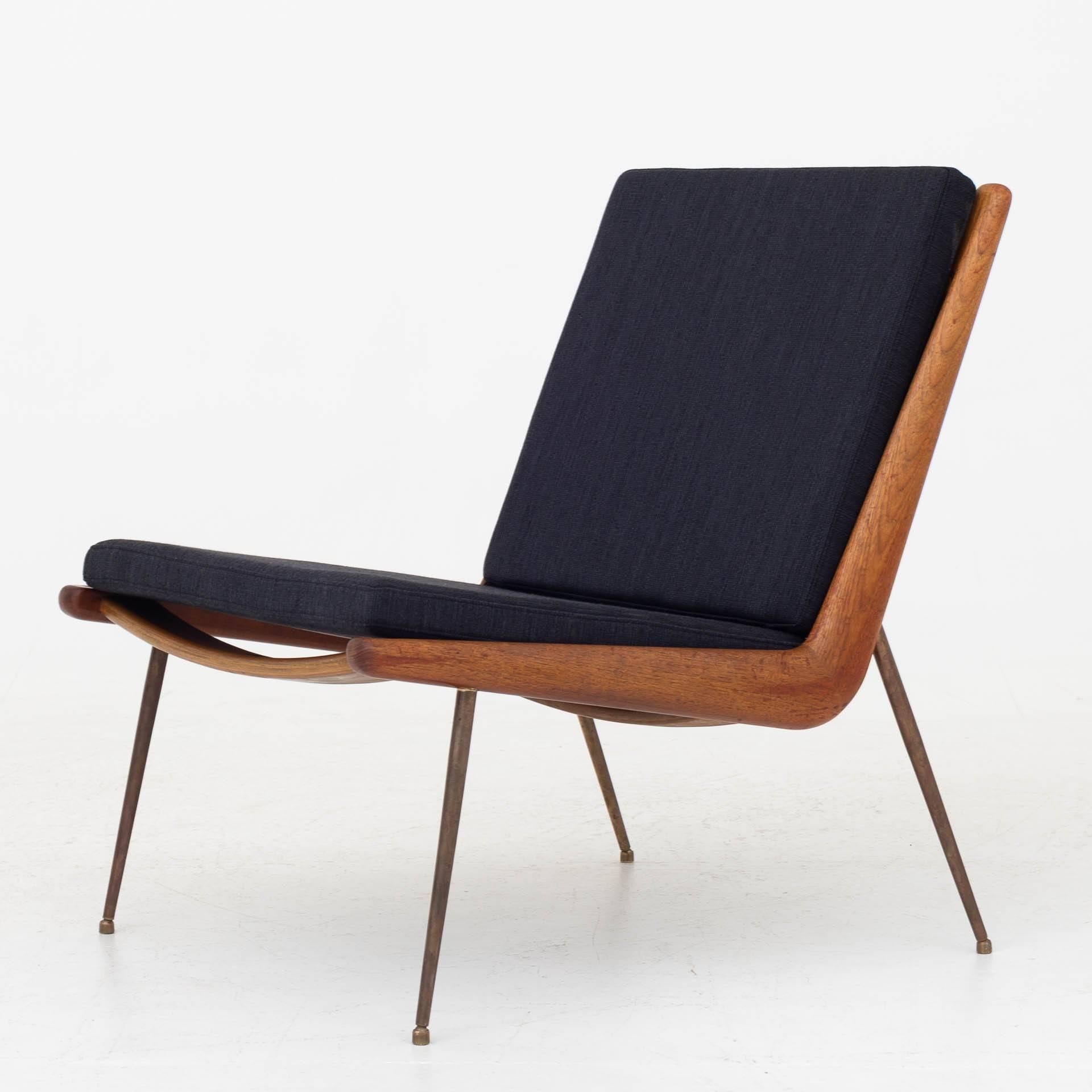 'Boomerang' easy chair in teak with legs of brass and new cushions in wool from Kvadrat (Balder 3, 192). Model with arms also available.  Maker France & Son.