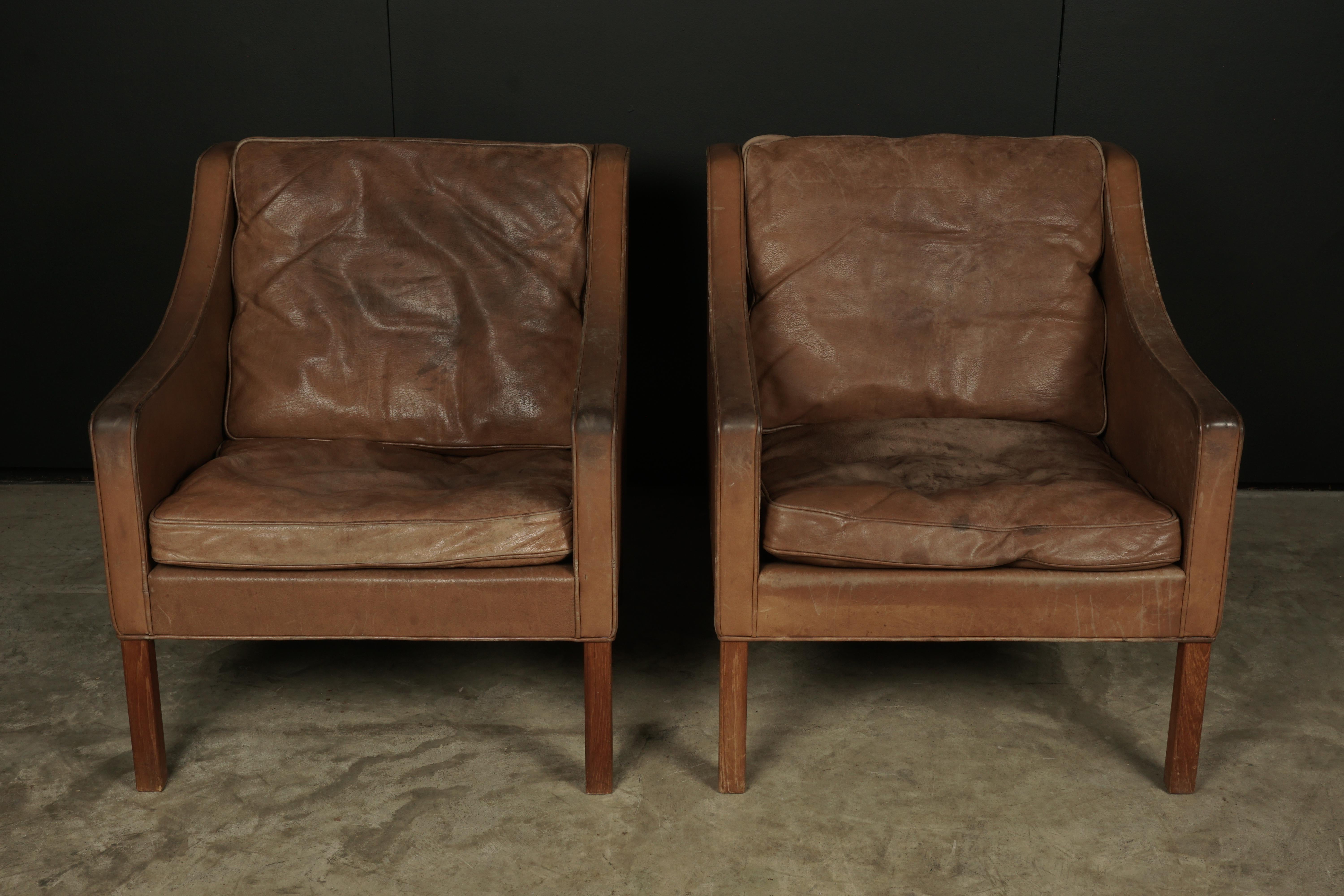 Pair of Borge Mogensen lounge chairs from Denmark, circa 1970. Original brown leather with nice wear and patina.