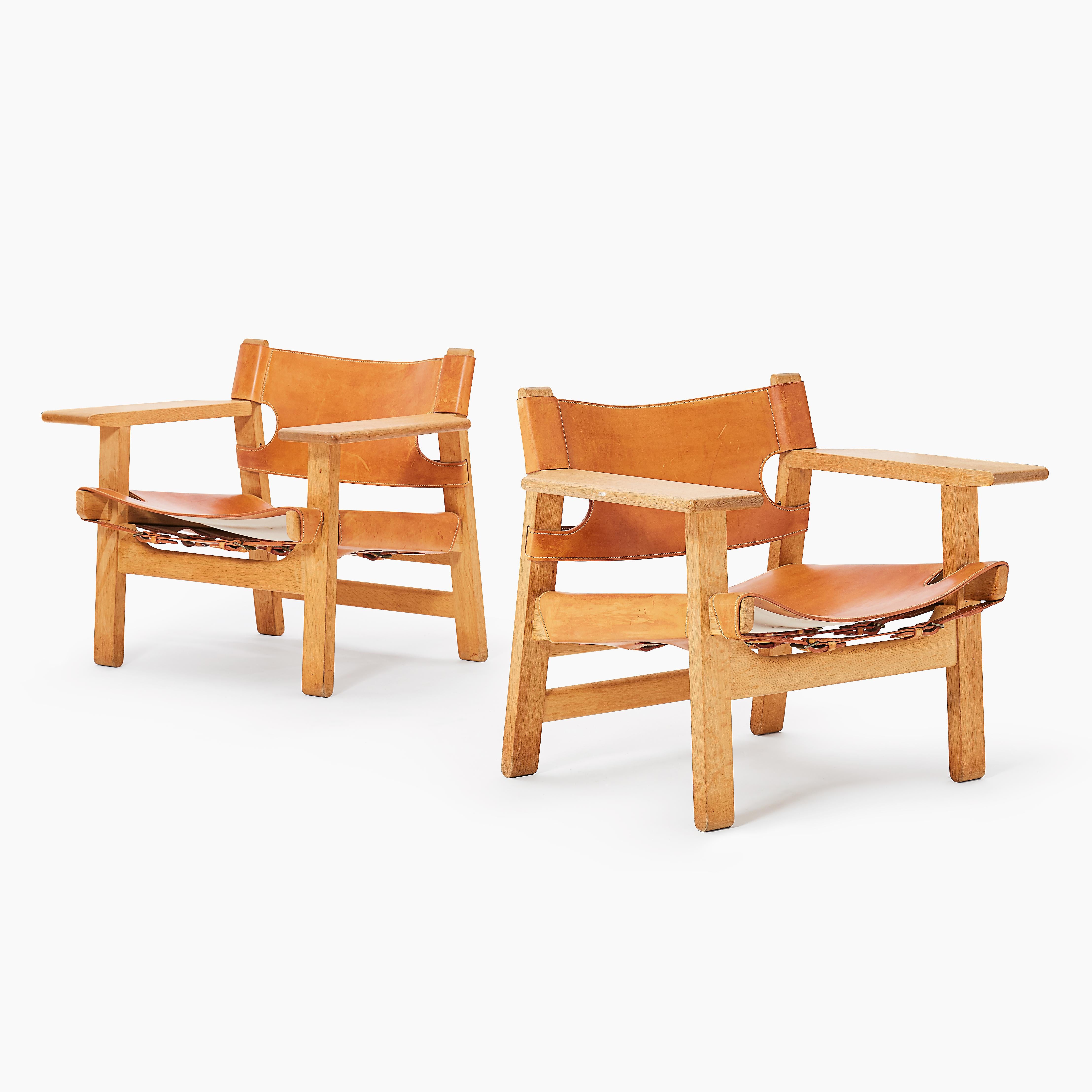 A lovely pair of early Spanish chairs, in solid oak and patinated cognac leather, designed by Børge Mogensen for Fredericia Stolefabrik, Denmark, in 1958.      Ships worldwide.





This item only ships to the US.