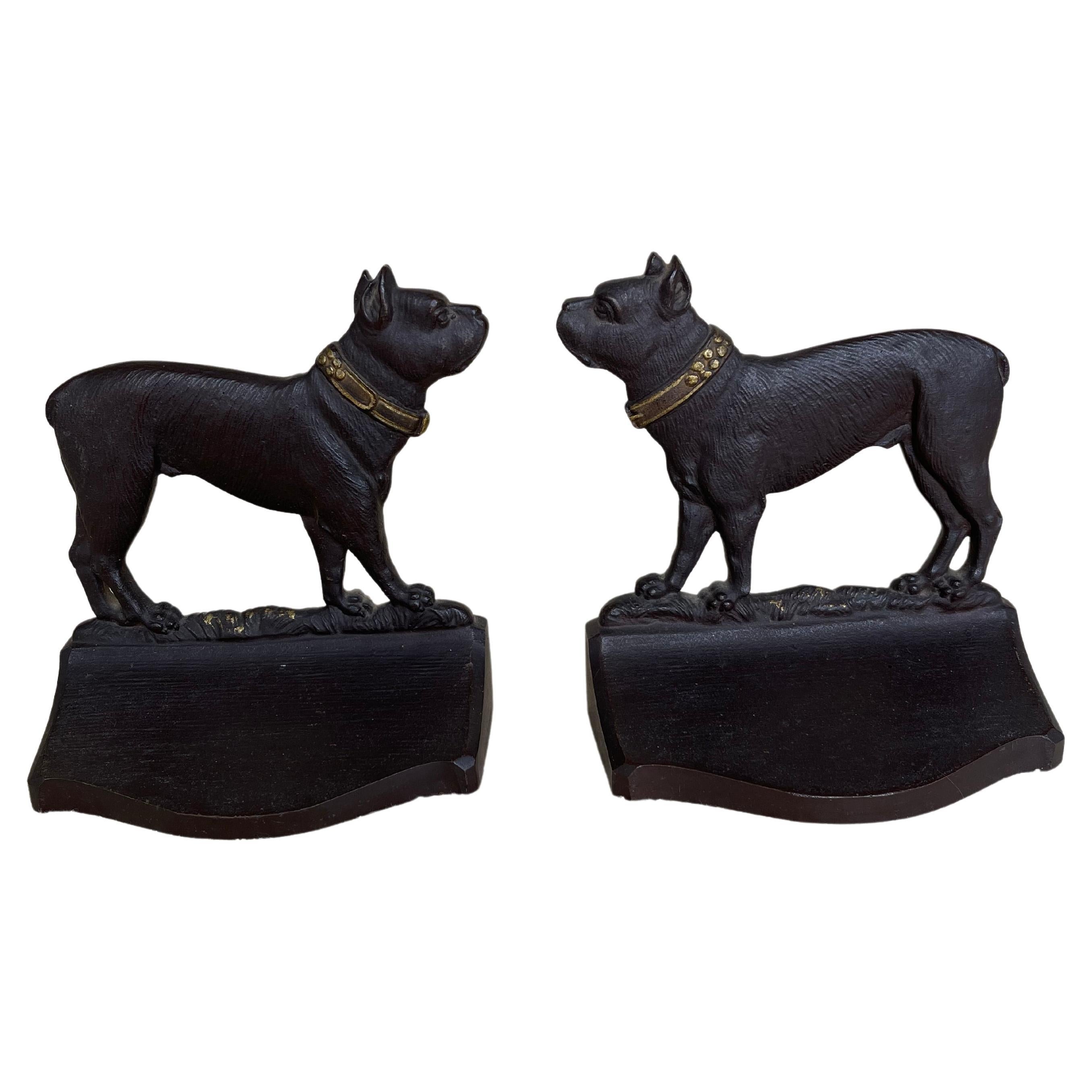 This pair of bookends are quite exceptionally cast. Note the special attention to detail to include the finely cast dog's coat.  Signed on the back 