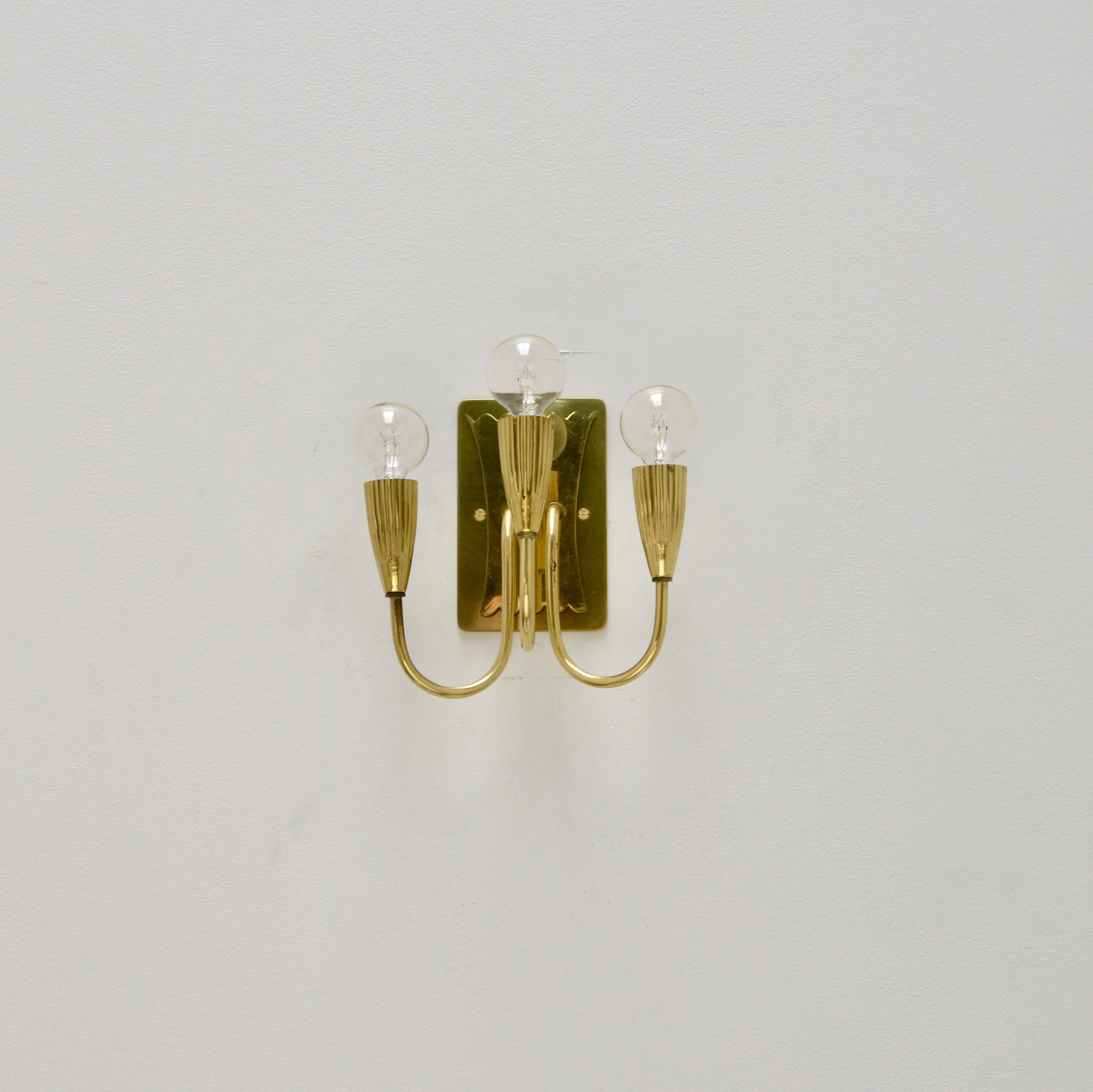 Pair of Botanical brass sconces from Italy from the 1950s. Partially restored, original finish. (3) E12 candelabra based sockets per sconce. Priced as a pair. Wired for use in the US. Lightbulbs included with order.
Measurements:
Height 9”
Depth