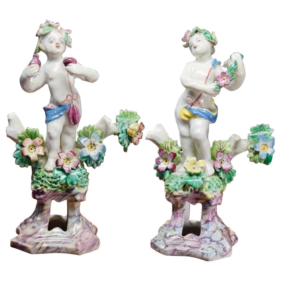 Pair of Bow Cherub Figures on Plinths, Decked with Flowers, circa 1765 For Sale