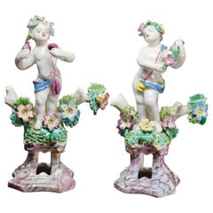 Pair of Bow Cherub Figures on Plinths, Decked with Flowers, circa 1765
