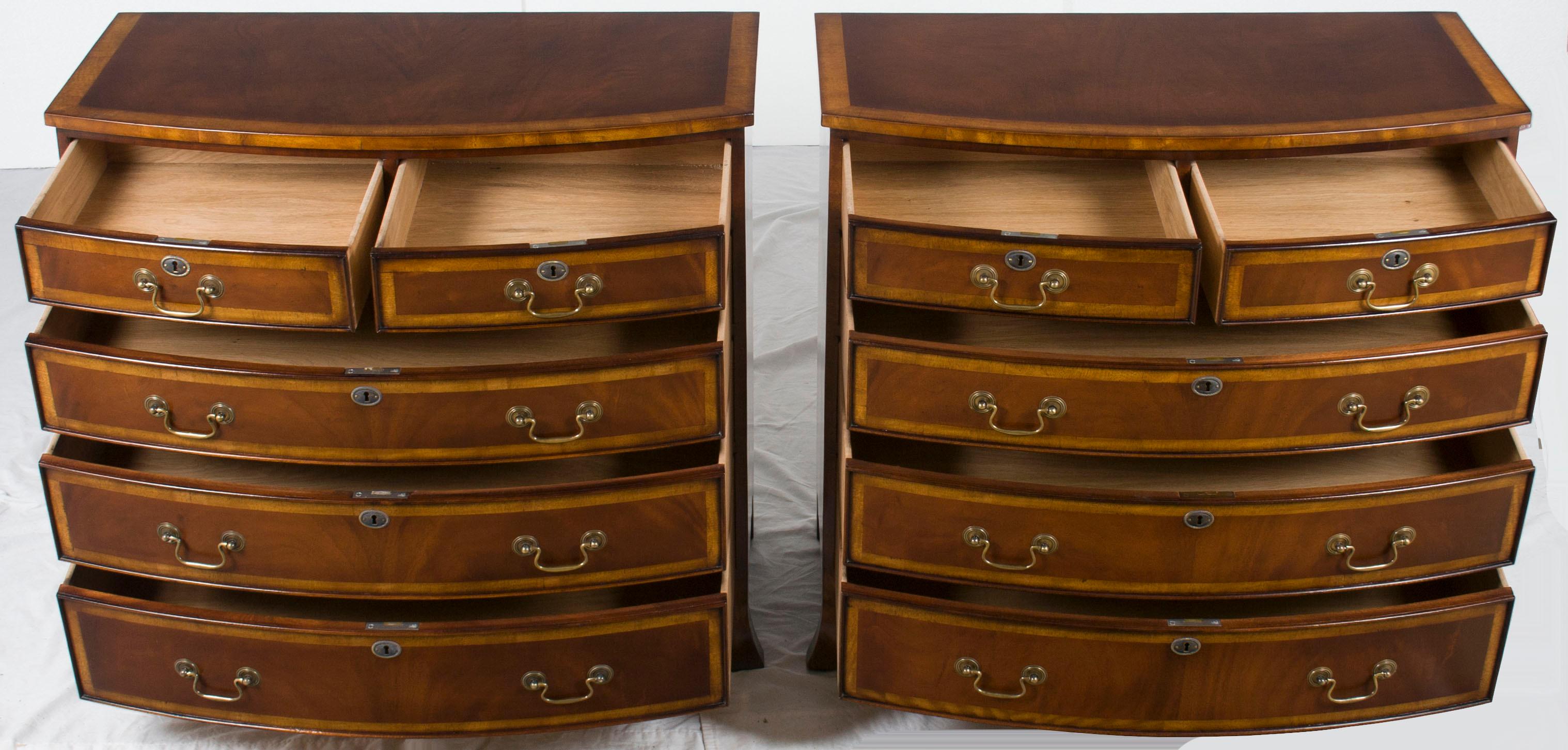This is a matching pair of newly handcrafted flame mahogany bow front chest of drawers. These dressers were recently made in England by a third generation furniture maker who uses Old World methods to create pieces that have a wonderful antique