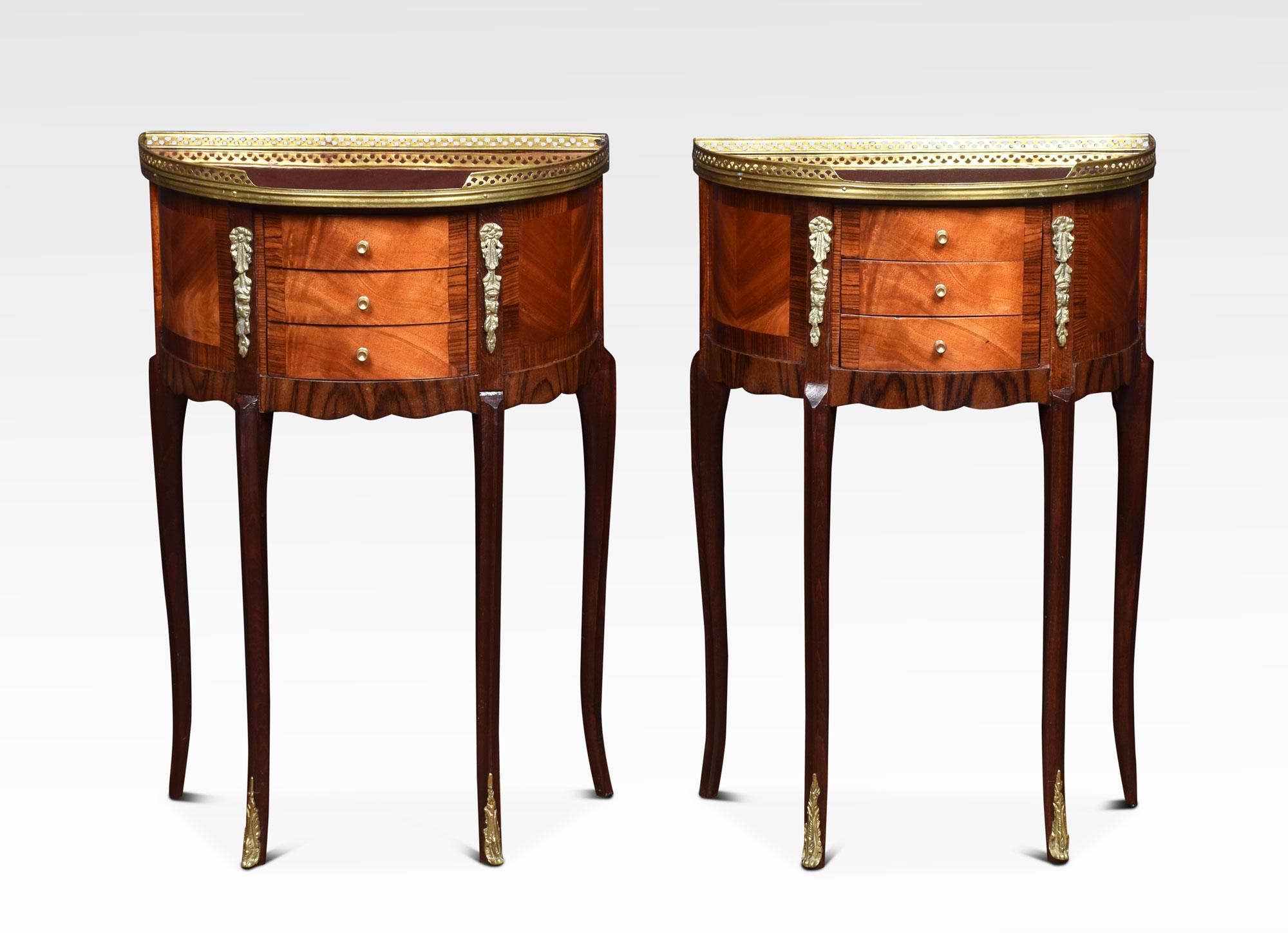 Pair of mahogany bedside chests, the bow-fronted tops with raised pierced gallery. Above three short draws drawers, all raised up on slender cabriole legs with gilt metal mounts.
Dimensions:
Height 28.5 inches
Width 19 inches
Depth 11 inches.