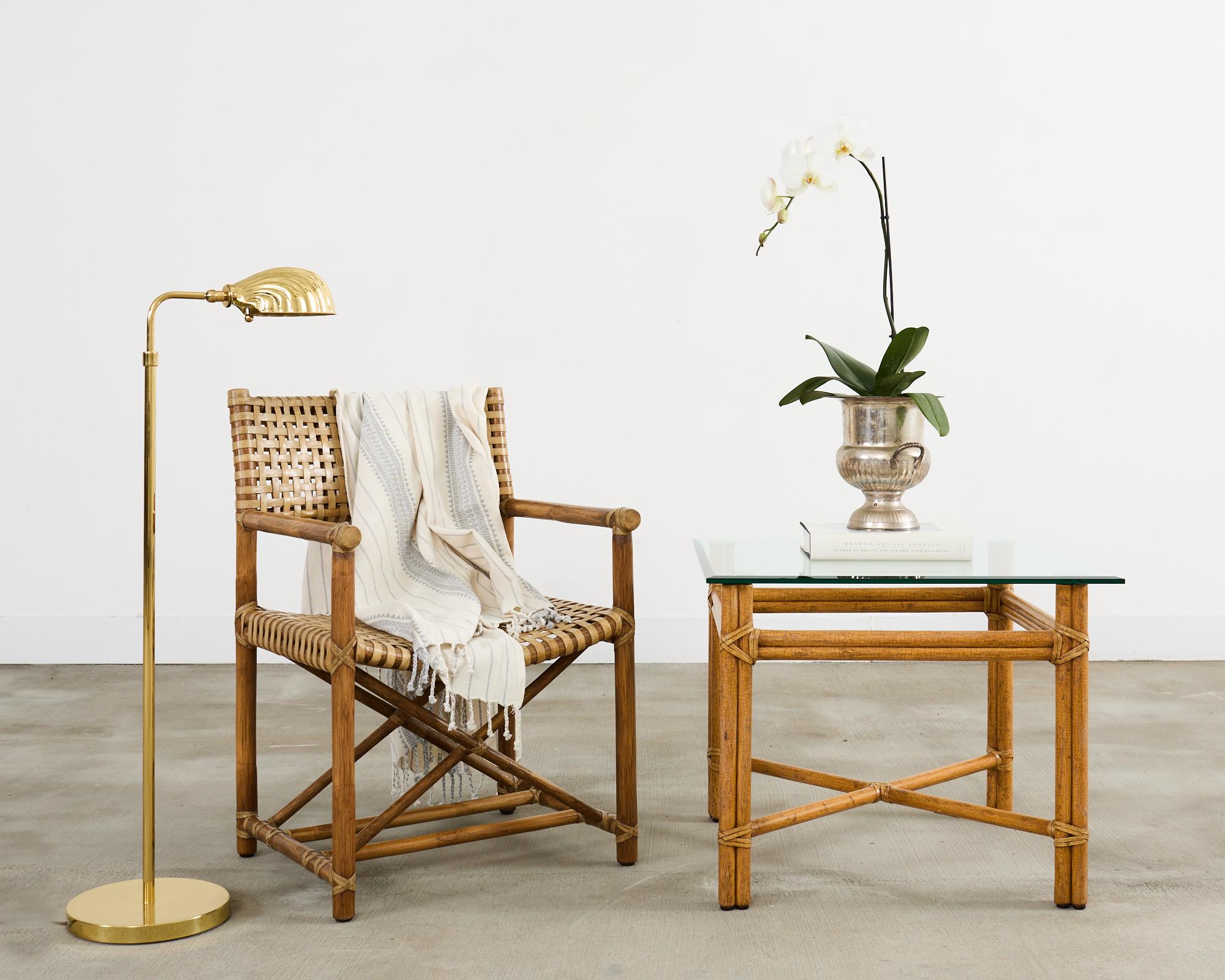 Stunning pair of pharmacy style brass floor lamps created by Boyd Lighting. The lamps feature whimsical shell-shaped heads in a Venetian grotto style. Each lamp adjusts from 42 inches high to an astonishing 58 inches high. The light is controlled by