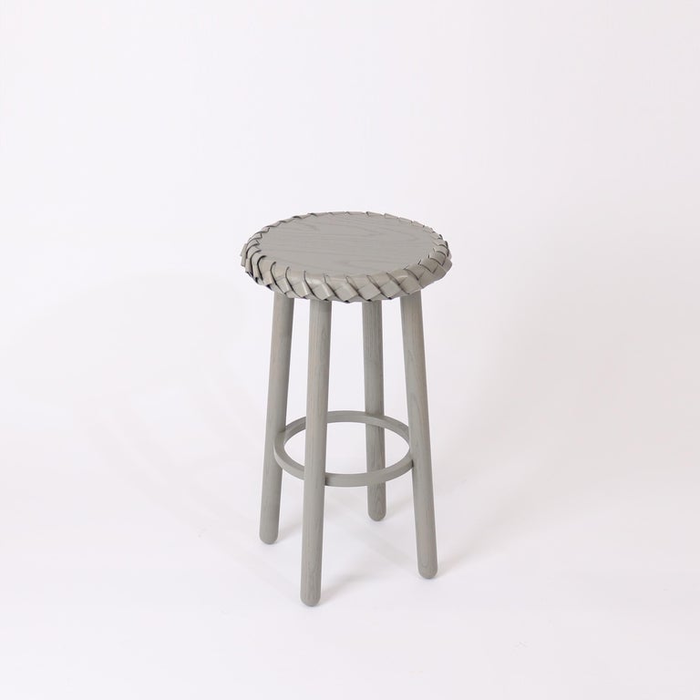 Braided stools are inspired by traditional braiding of the rough edges of primitive tools. Implemented here more decoratively, each table is CNC cut in harmony with the angle of each braid, resulting in a soft and unified edge treatment marrying