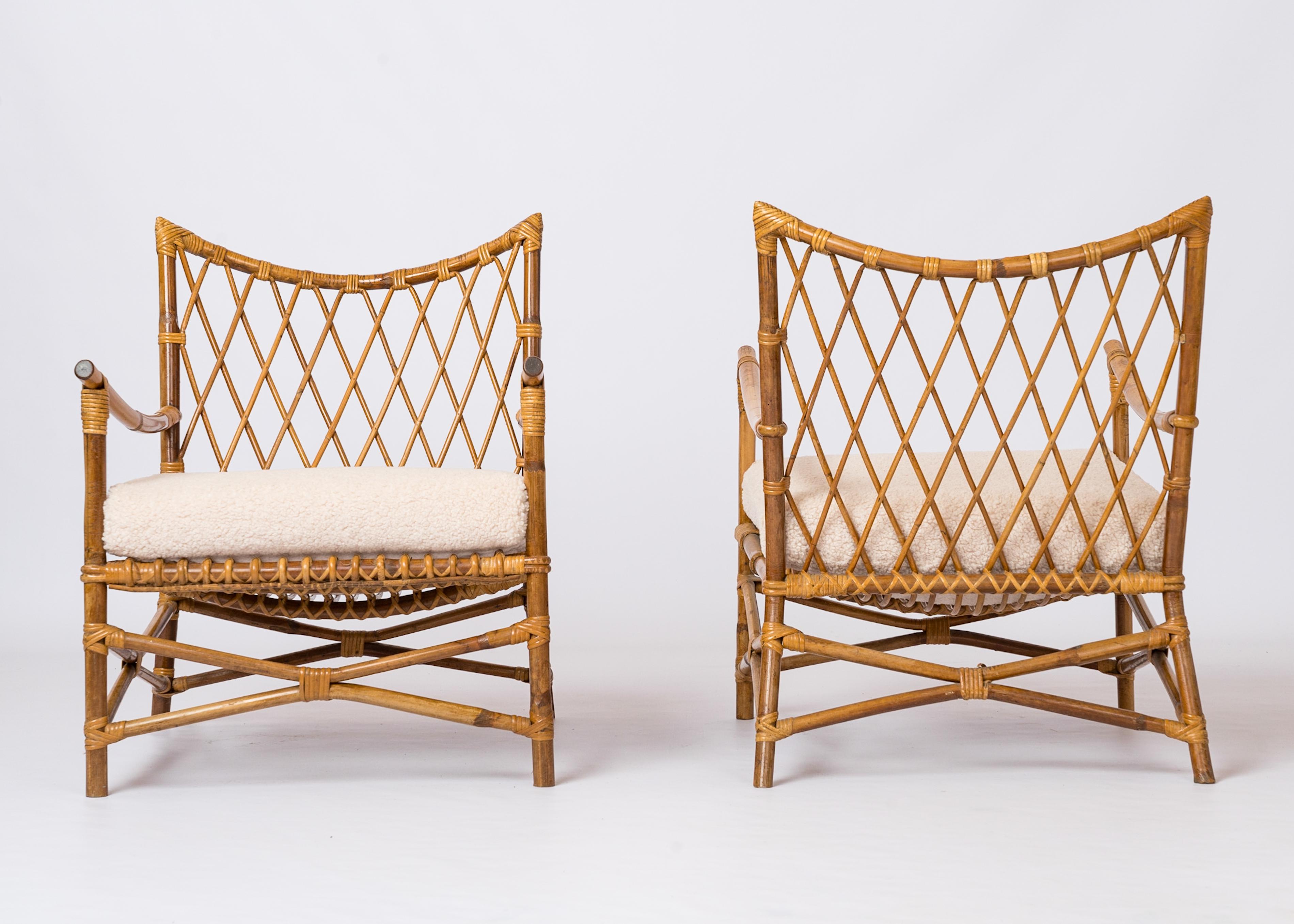 French Pair of Braided Rattan Lounge Armchairs w. Off-White Boucle Cushions - 1960's