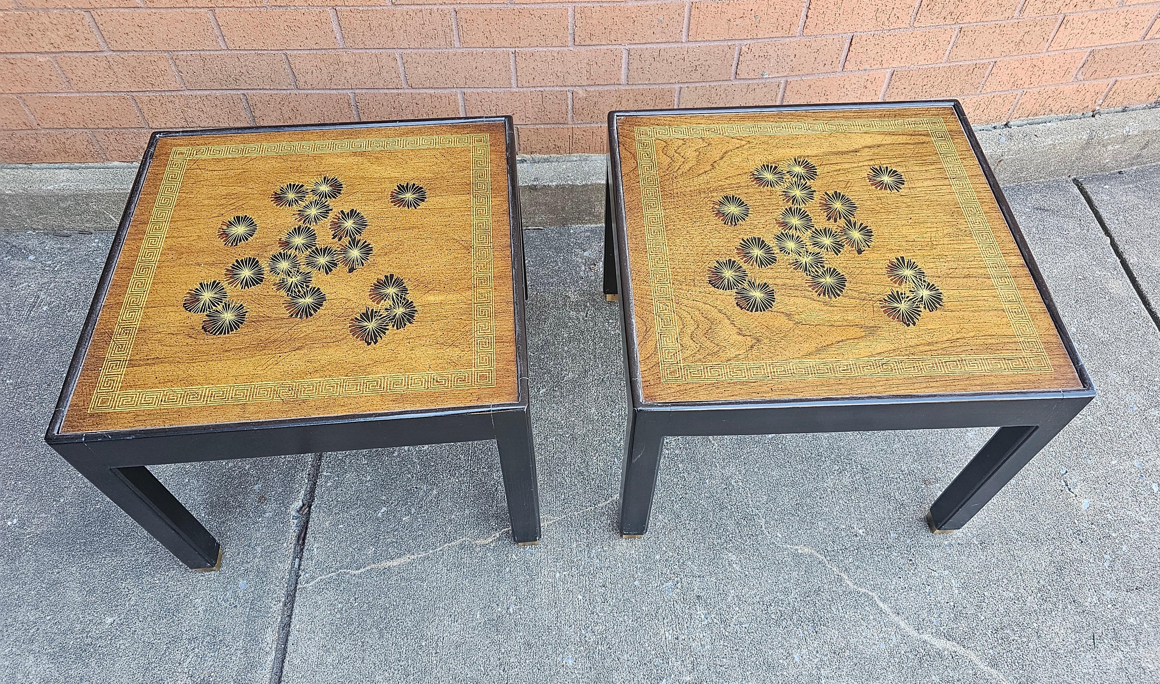 Pair Of Brandt Mid-Century Modern Partial Ebonized And Decorated Mahogany Side Tables with brass capped legs. Measure 21