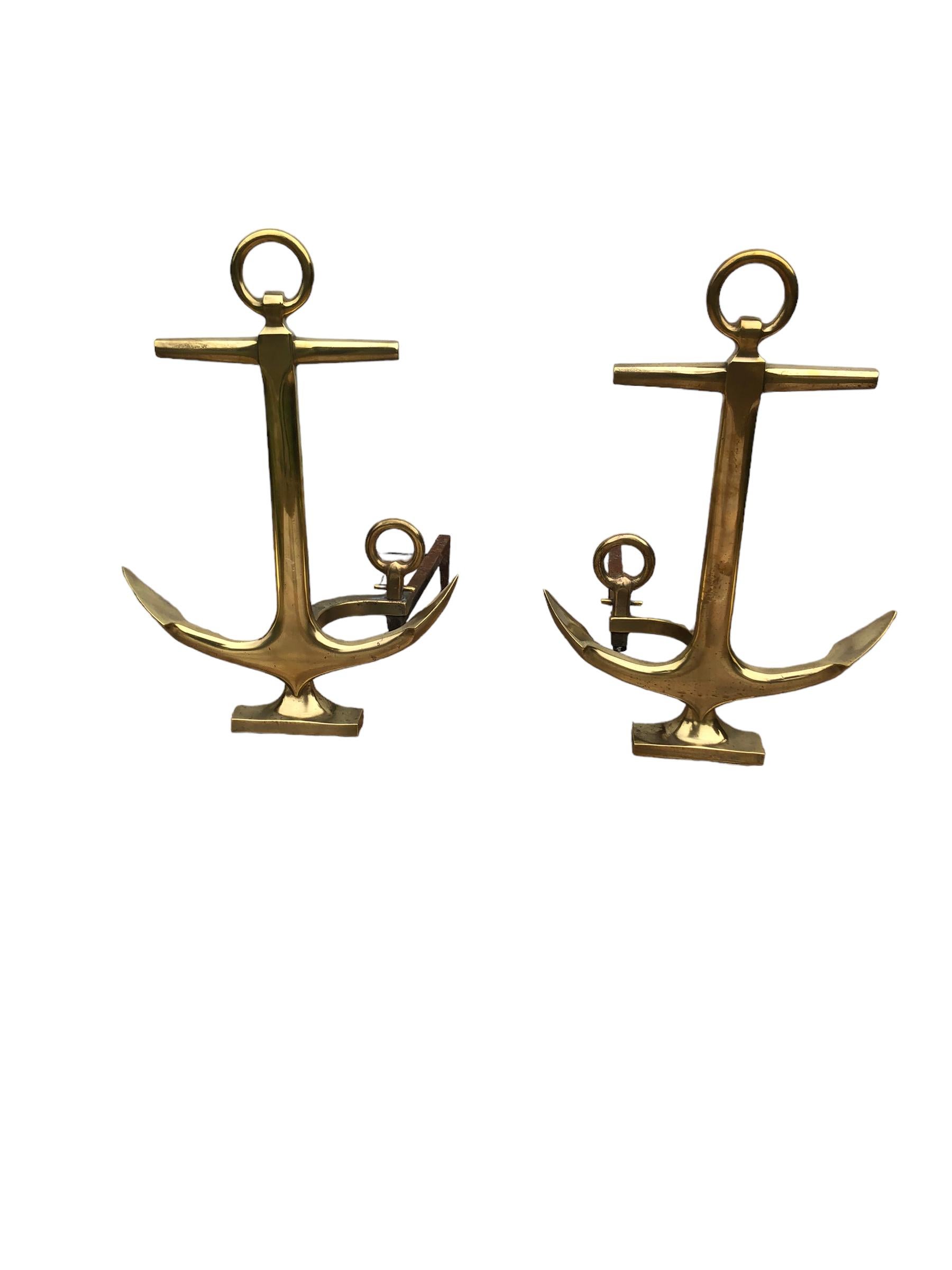 Pair of Solid Brass Anchor Andirons manufactured by Rostand of Milford, CT. Milford was a shipbuilding town so this pair of andirons fit the town perfectly.