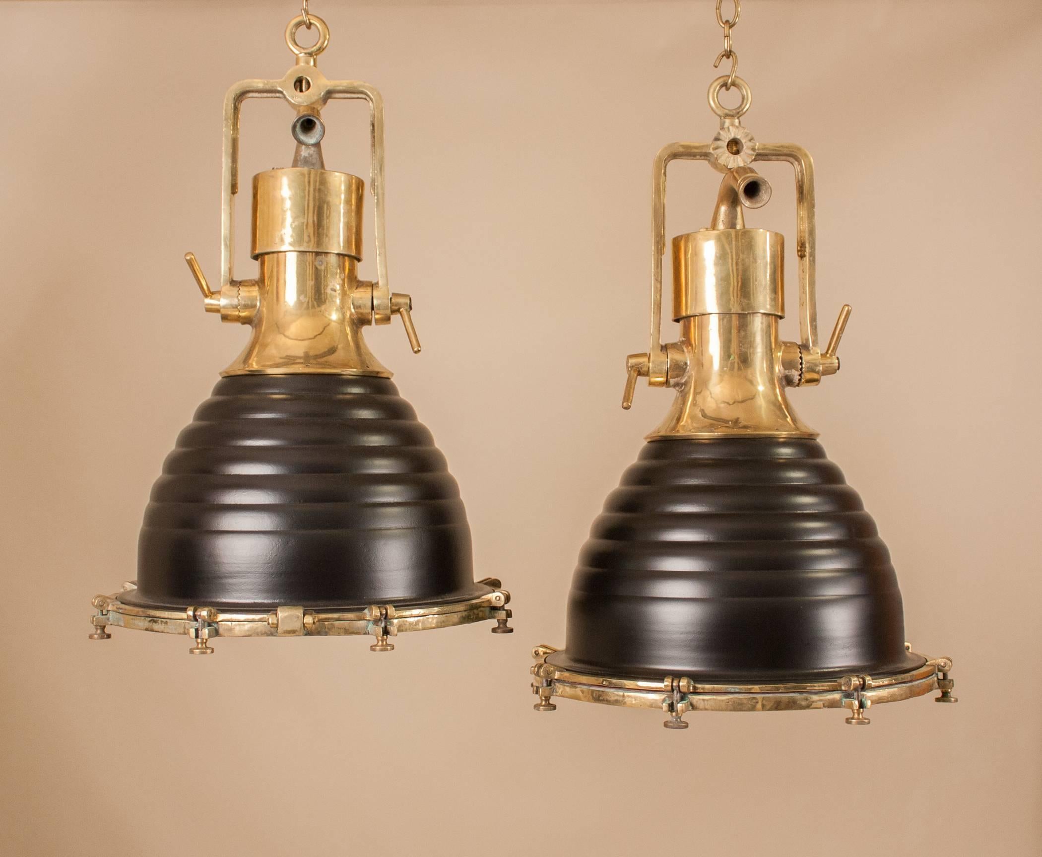 Impressive pair of large nautical ship's deck lights in a combination of polished brass and satin black. These authentic Industrial pendants, manufactured by Wiska, Germany in the 1960s, feature professionally painted original beehive shades, solid