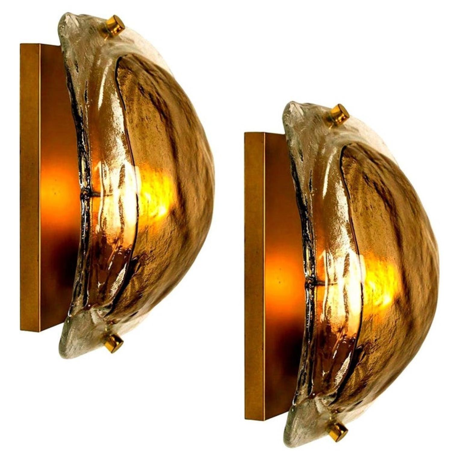 Pair of high end wall sconces made of hand blown clear and opal and brown (smoked) Murano glass on a messing hardware designed and produced by J.T. Kalmar, Austria in the 1960s. Minimalistic design executed with a taste for excellence in