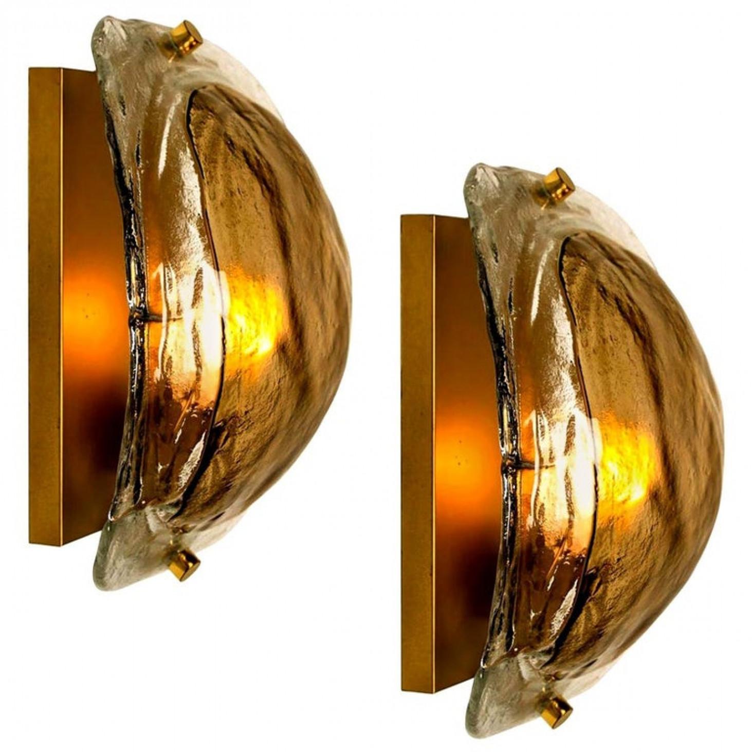 Pair of high end wall sconces made of hand blown clear and opal and brown (smoked) murano glass on a messing hardware designed and produced by J.T. Kalmar, Austria in the 1960s. Minimalistic design executed with a taste for excellence in
