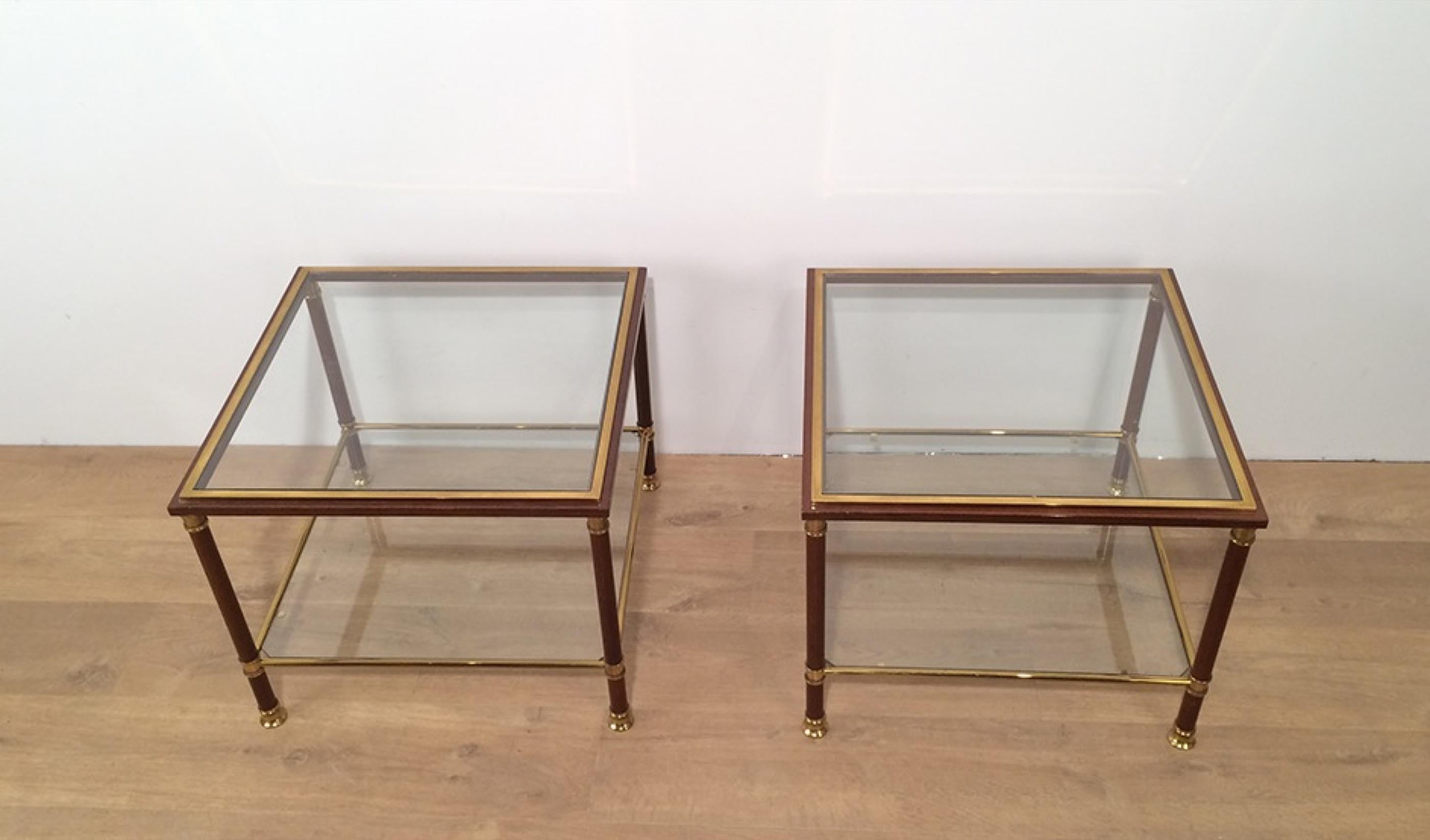 This nice pair of side tables is made of brass and burgundy lacquer on steel. These end tables are very elegant and the quality is very good. This is a nice French work, circa 1970.