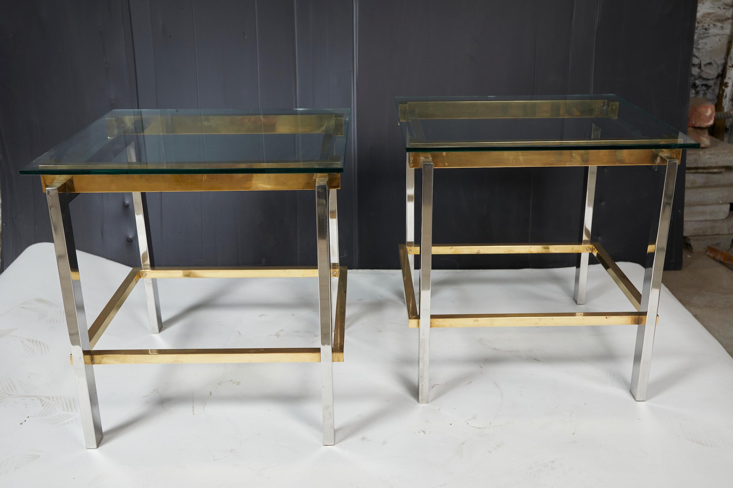 Pair of brass an chrome side tables by Romeo Rega with glass top.