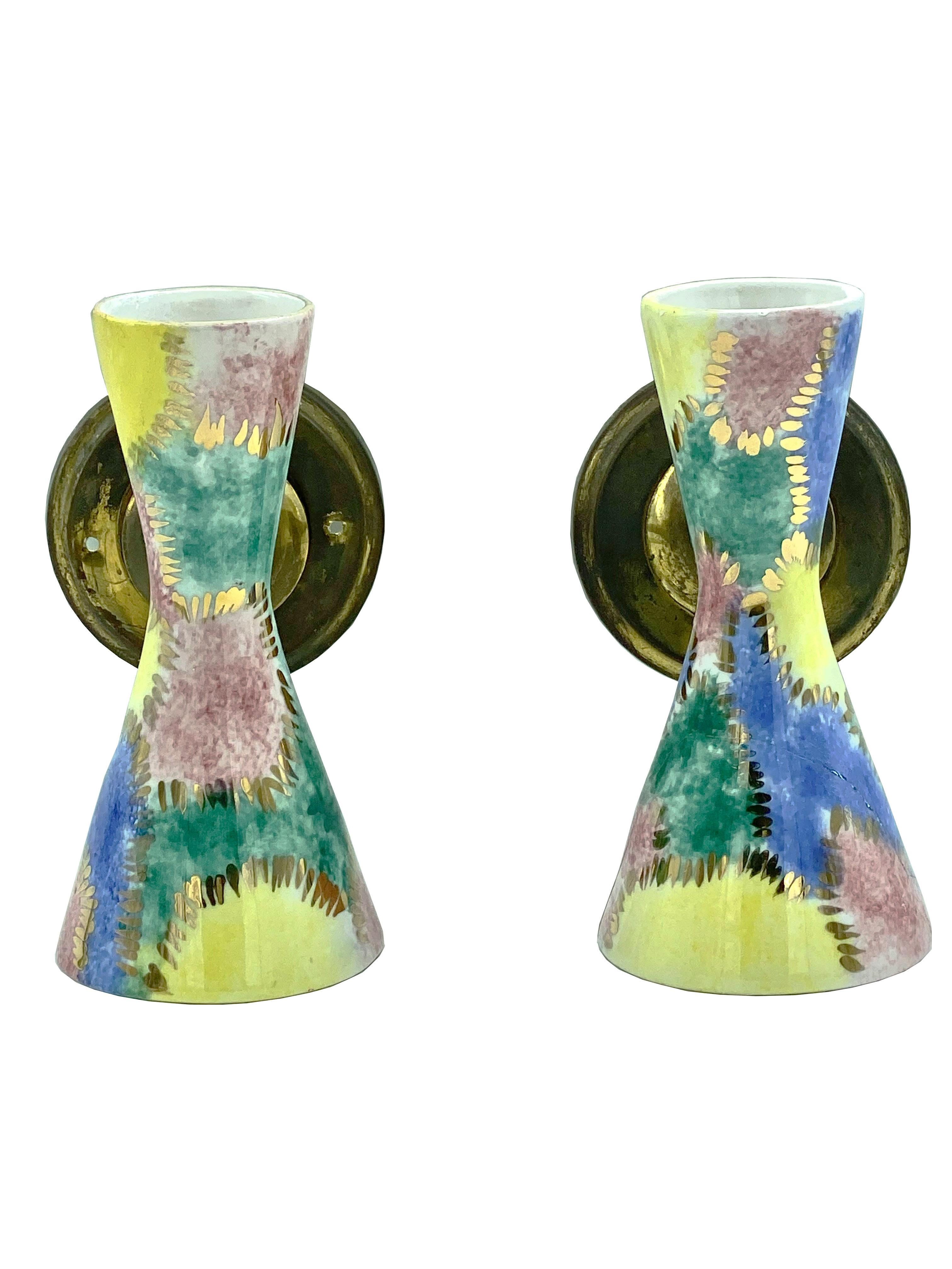 Pair of hand-decorated cone-shaped wall lamps from the 1950s, a particular workmanship where time seems to have marked its years. Indirect, wide lighting above and cut-off lighting below, creating a visual impact of decoration and architecture on