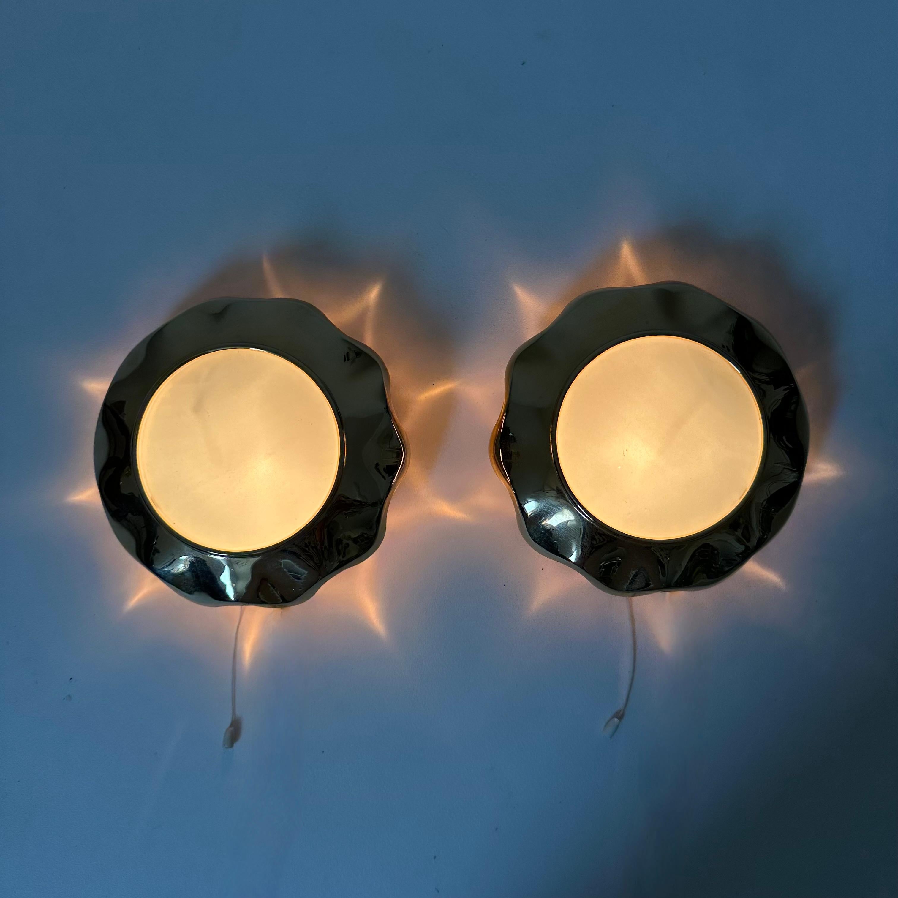 French Pair of brass and glas sunburst wall lamps, 1970s For Sale