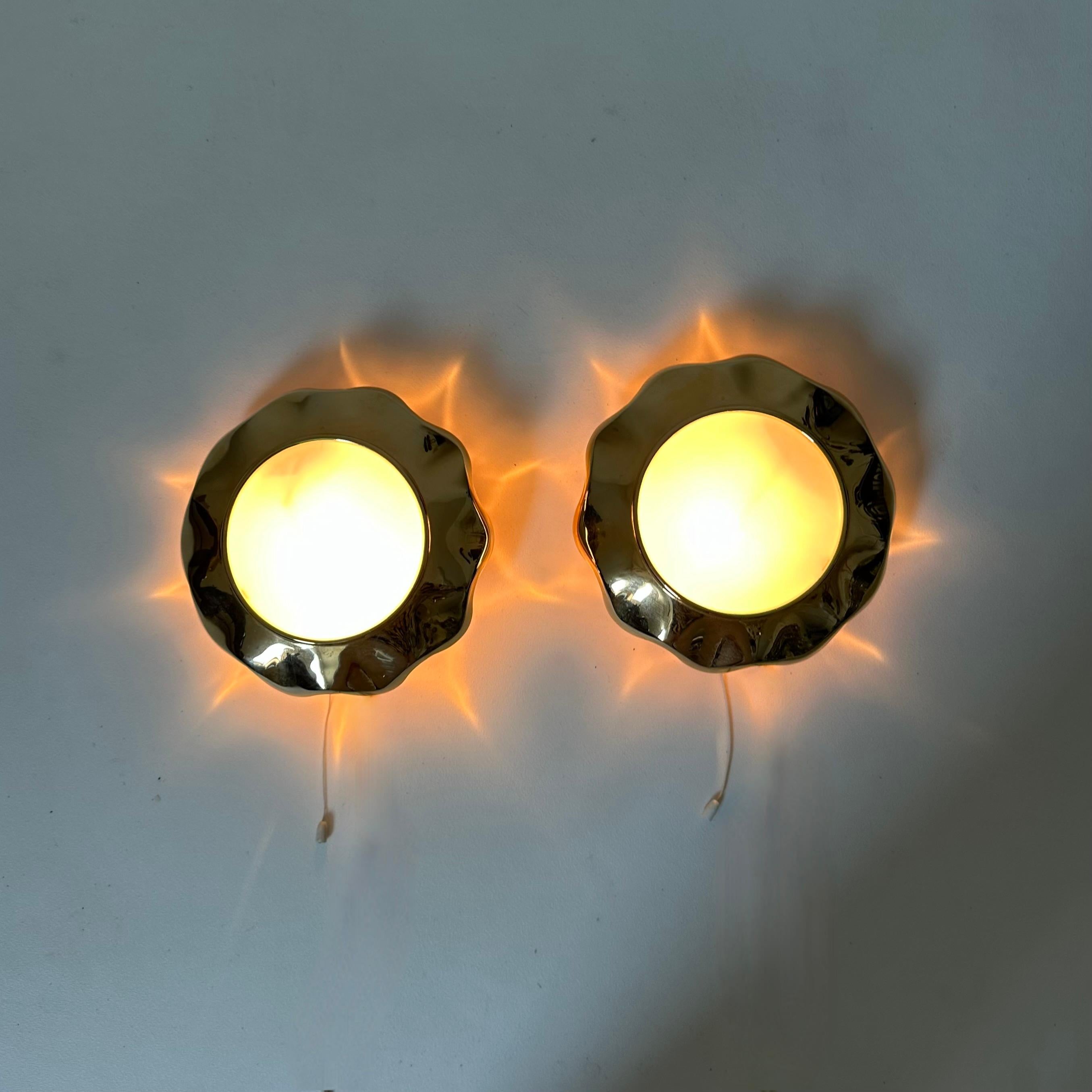 Late 20th Century Pair of brass and glas sunburst wall lamps, 1970s For Sale