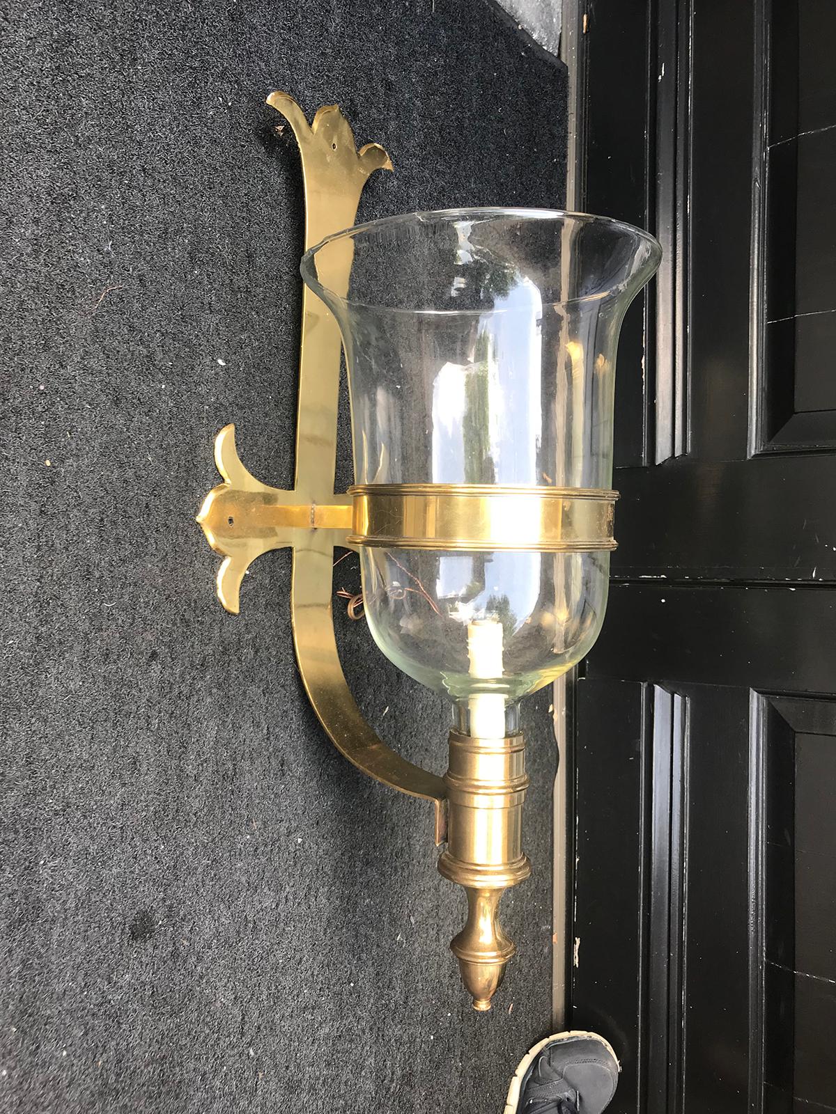 Pair of brass and glass Chapman sconces, circa 1970s.