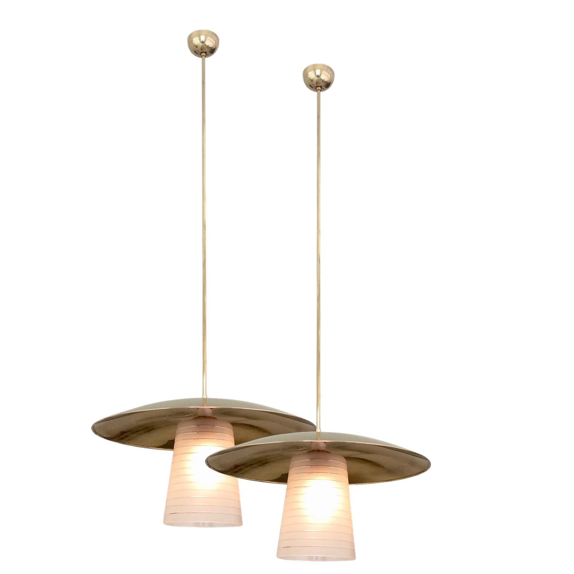 Pair of hanging lamps, circa 1950, Italy.
Polished brass and lined frosted glass.
One E 27 bulb of 40 W.
Dimensions: 135 cm height, diameter: 50 cm.
Good original condition.
All purchases are covered by our Buyer Protection Guarantee.
This item can